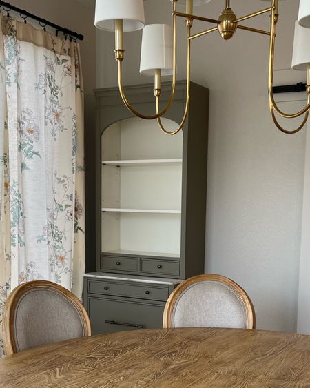 New dining room hutch! Perfect as a solo piece or you can build it out with more pieces to make a more substantial sideboard credenza buffet. 

French country upholster dining chairs, floral curtains, unlaquered brass visual comfort chandelier, pedestal table 

#LTKfamily #LTKhome