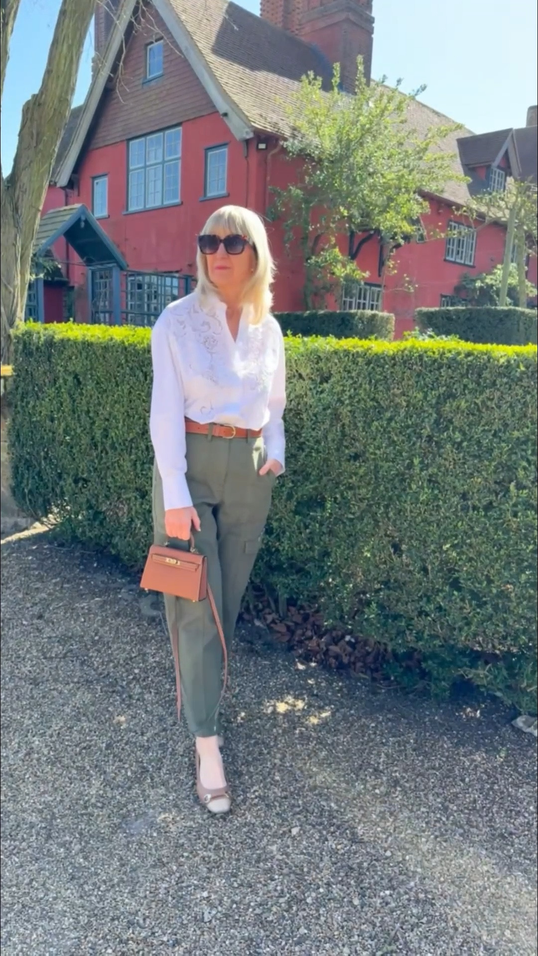 Weekend look with khaki cargo trousers, crisp white embroidered shirt and tan accessories

#LTKAprilSpotlight #LTKspring #LTKuk