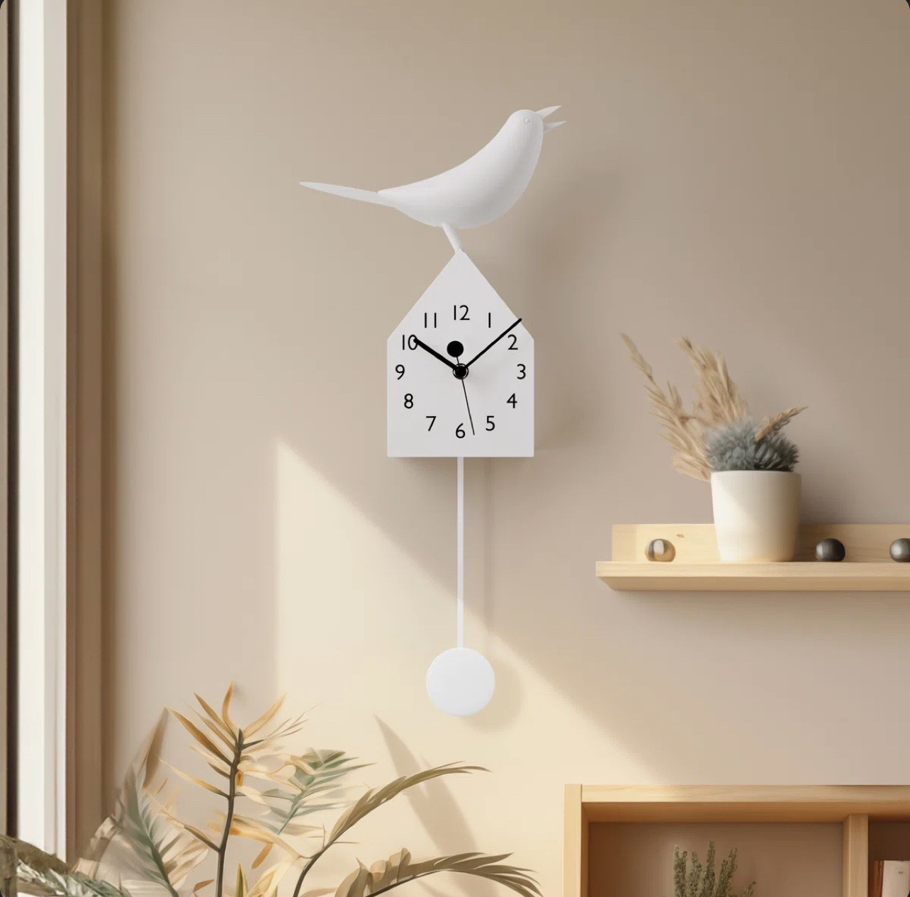A modern-style wall clock that’s both versatile and a great statement piece. The pendulum is removable, so it can also be used as a stylish table clock. It also comes in black.

#LTKHome