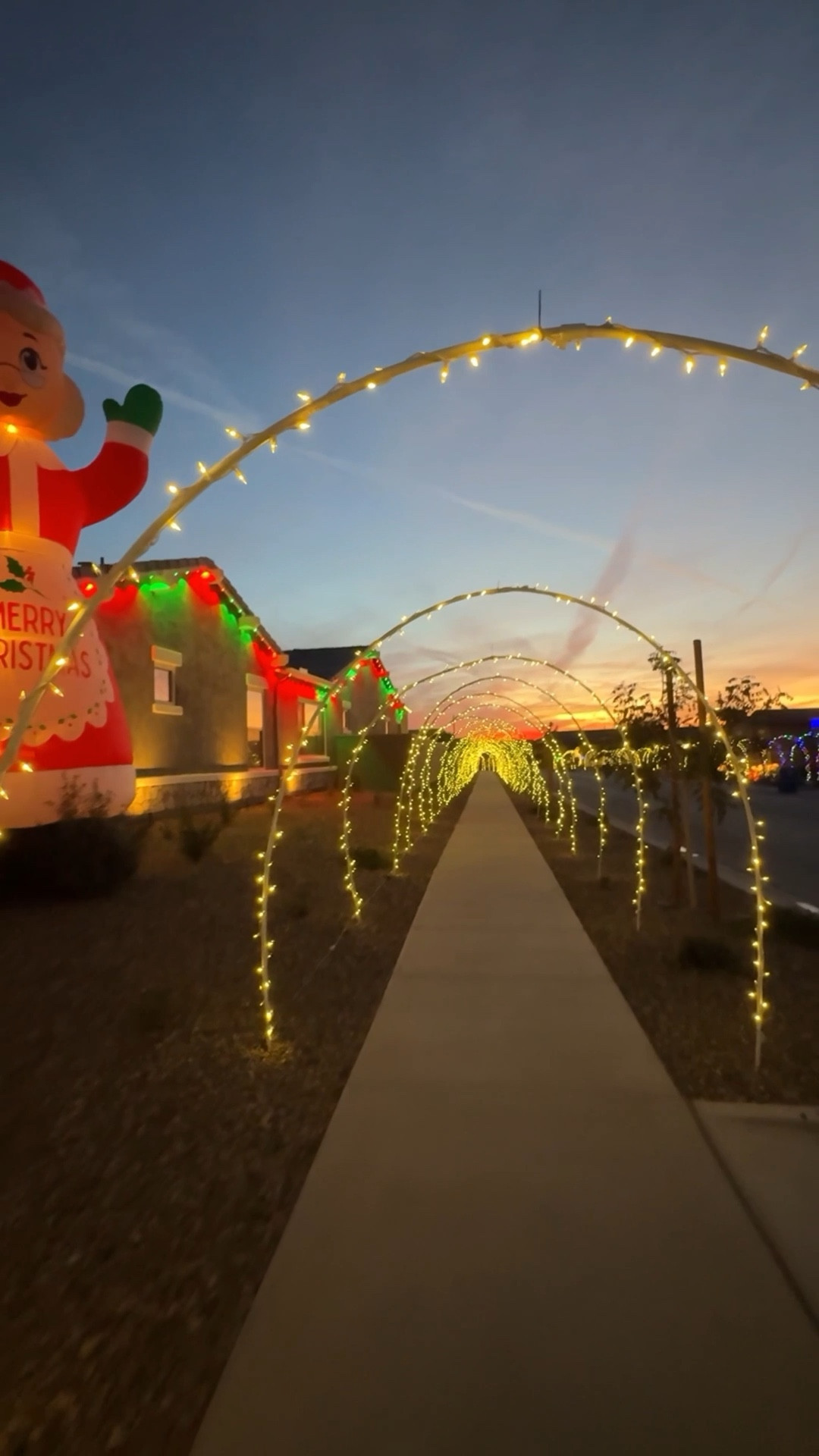 DIY Light-Up Christmas Arches for Your Sidewalk!  Save this DIY for a weekend project and turn your walkway into a magical holiday tunnel! This outdoor Christmas decor is so fun for the holidays. Here’s what you need: 

* (2) 10-ft PVC pipes
* (1) Slip coupling
* (2) Rebar stakes
* LED string lights
* Zip ties + extension cord

Step 1: Hammer rebar 12–18” into the ground on each side of your sidewalk. Leave about 8–10” sticking out.

Step 2: Slide your PVC pipes onto the rebar and bend them to meet in the middle. Join the ends with your coupling to form a full arch.
 Step 3: Wrap with outdoor LED string lights and secure with zip ties. Plug in and ta-da! Instant Christmas magic.

#LTKSeasonal #LTKHoliday #LTKHome