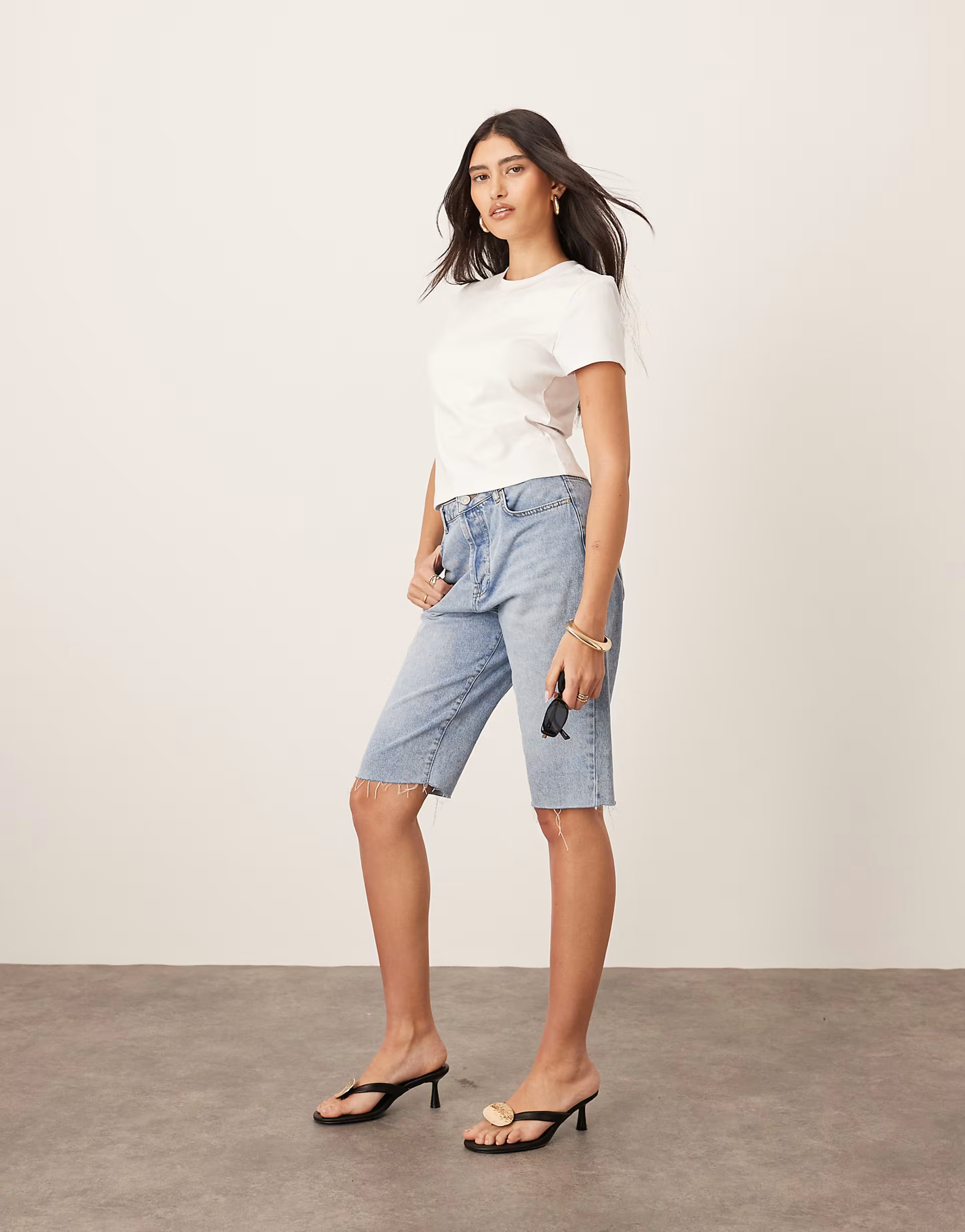 ARRANGE Cleo denim longline short with raw hem in mid wash blue | ASOS (Global)