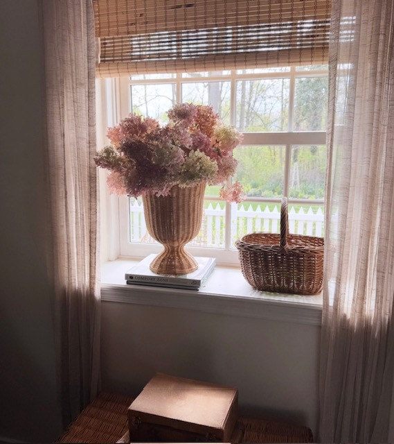 I'm readying this scalloped rattan urn for the summer, where it will live in the fireplace after our last spring fire. Filled with hydrangeas, I think it will bring some life to otherwise empty space. 

 #LTKSeasonal #LTKHome
