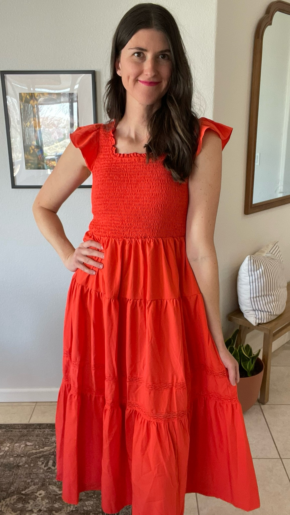 Gorgeous orange red smocked dress with flutter sleeves. Tiered dress. Wearing a medium. 

#LTKFindsUnder50 #LTKOver40 #LTKFestival