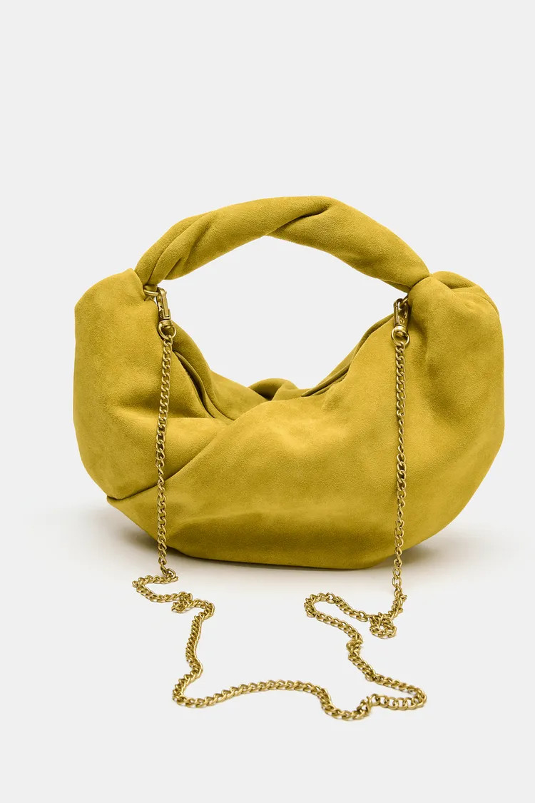 Leather handbag with a gathered body. Features a detailed top handle. Detachable metal chain shou... | Zara US