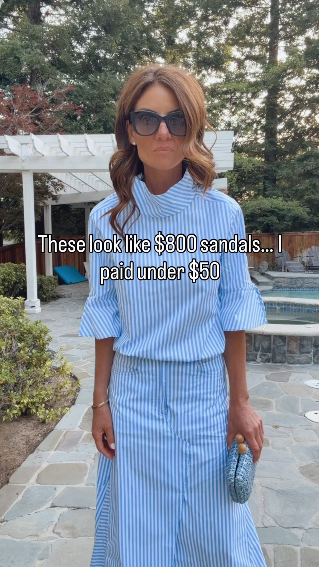 These sandals look like $800 designer—but they’re under $50 👀

Wearing the cutest striped set that feels elevated but still easy. The skirt has the best shape and button detail down the side, and the matching top has a flattering neckline that works on everyone. Both pieces come in other colors so you can mix and match.

Finished it with these look-for-less sandals) light blue clutch, and classic navy sunglasses.
￼ I am 5'7" tall. I am wearing size extra small in the skirt and small in the top. The sandals run a little big. Size diwn a half size. 