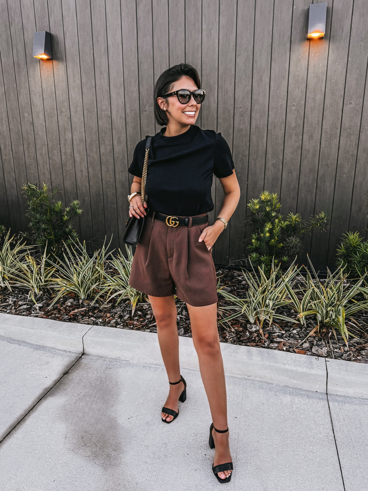 Summer to Fall Outfit

🖤 Reviews on all products! 
• COS crewneck black t- shirt - S
• Amazon casual women brown shorts - S
• Gucci leather belt - 80
• Saint Laurent designer quilted bag 
• Hermes designer inspired women black leather slide sandals -7
• Sam Edelman black block heel sandal - 7.5
• Amazon black headband

Old Money Fall Outfit | Classy Fall Outfit | Fall Neutrals | Fall Chic | Chic Fall Outfits | Fall Outfits Petite | Fall Outfits Women | Fall Capsule Wardrobe | Fall Casual Outfits | Fall Vacation Outfits |  Fall Outfits | Fall Fashion | Fall Style | Fall OOTD | Fall Looks | Fall Outfit Ideas | Fall Outfit Inspo | old money looks | old money aesthetic | old money fashion | old money style | old money outfits | old money style women | old money | old money fall | neutral outfit | neutral summer outfit | neutral style | classic style | classic outfits | chic outfits | chic summer outfits | chic style | casual chic | quiet luxury | french style | french fashion | french girl style | Parisian chic | Parisian style | minimalist | minimalist fashion | capsule wardrobe | capsule wardrobe summer | capsule wardrobe fall | petite outfits 

#LTKSeasonal #LTKItBag #LTKShoeCrush

#LTKFindsUnder100 #LTKOver40 #LTKStyleTip