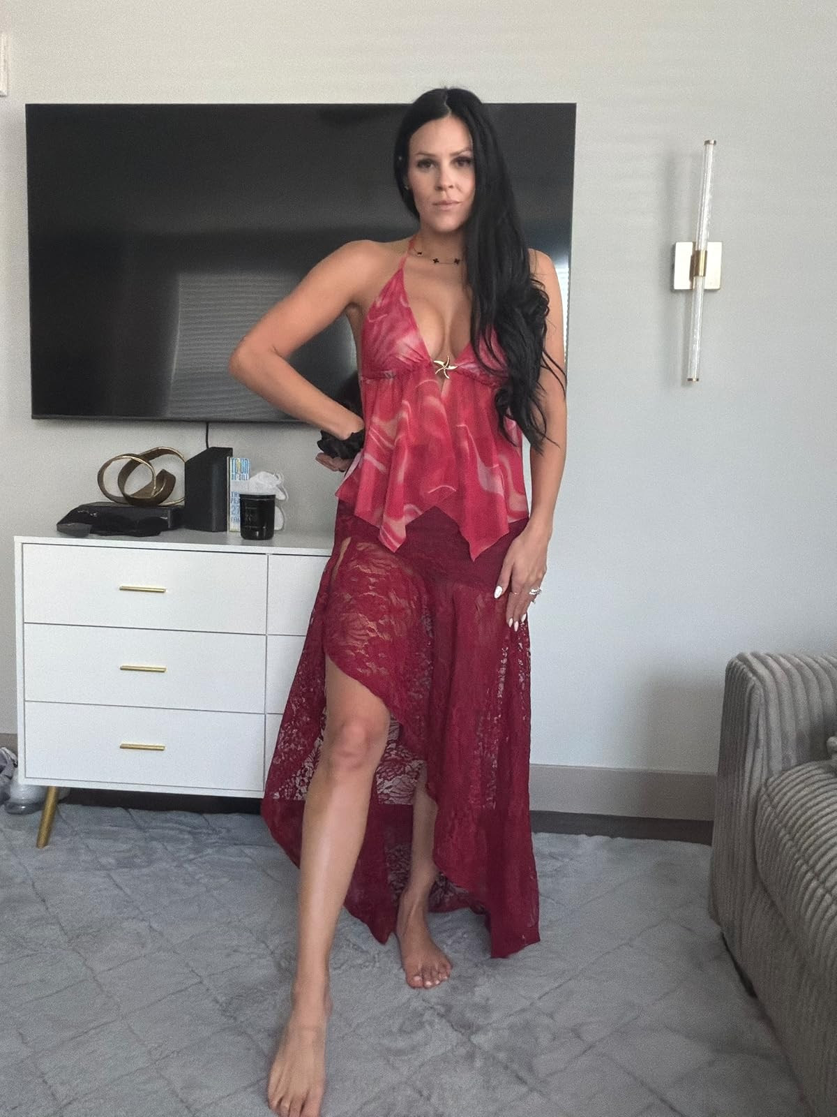 Bold in burgundy. This deep red halter top with a gold starburst accent and matching lace high-low skirt is the ultimate statement for a romantic night out. #RedHot #LaceSkirt #LTKstyletip 

 #LTKdayinmylife #LTKgrwm #LTKootd