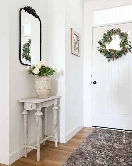 Entryway styling with vase, faux ranunculus and a gorgeous mirror. All affordable from Amazon. 

Home decor, summer decor 

#LTKFindsUnder100 #LTKHome #LTKFindsUnder50
