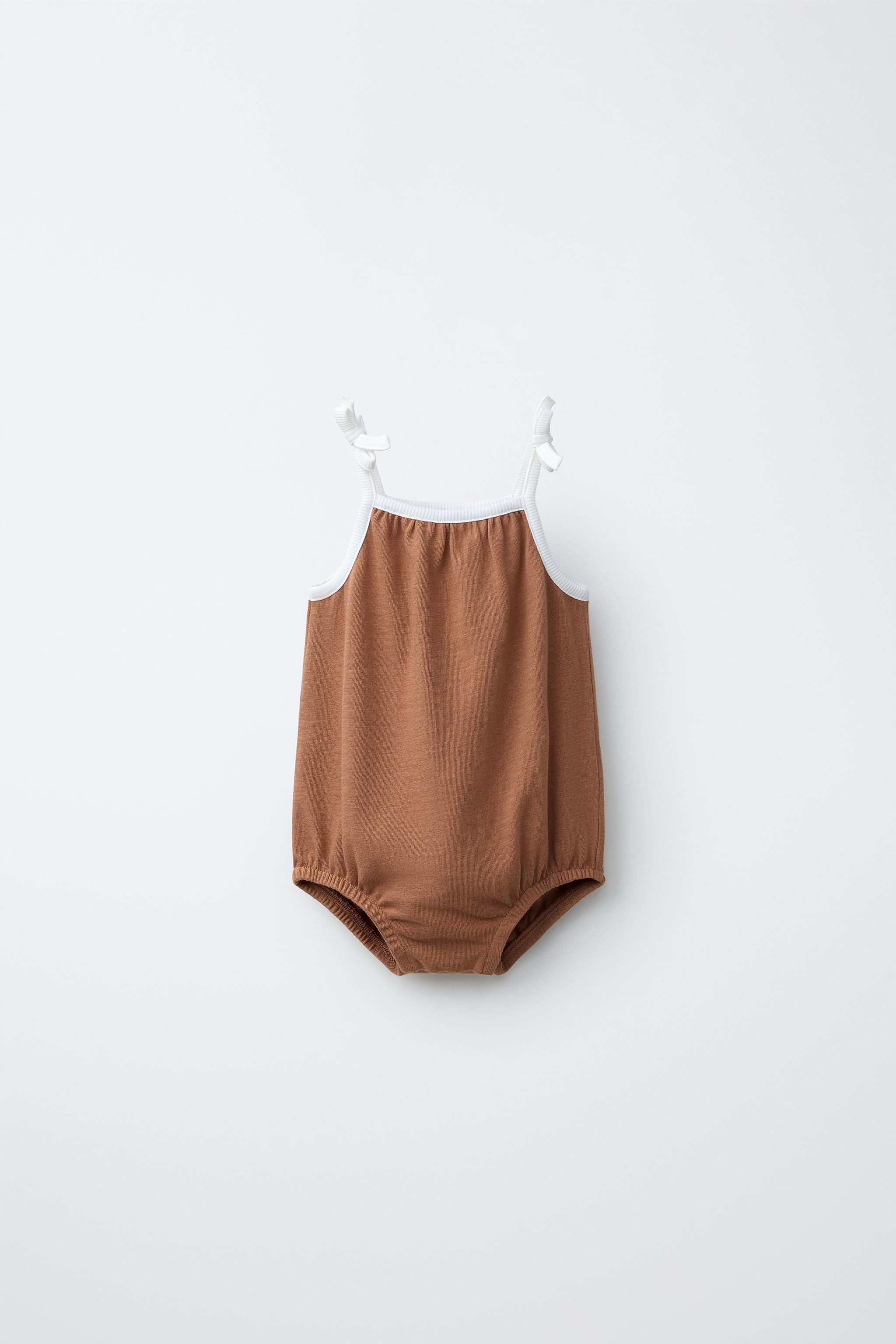 Romper with a straight neckline and straps with bow appliqu\u00e9s. Snap button closure at the bo... | Zara US