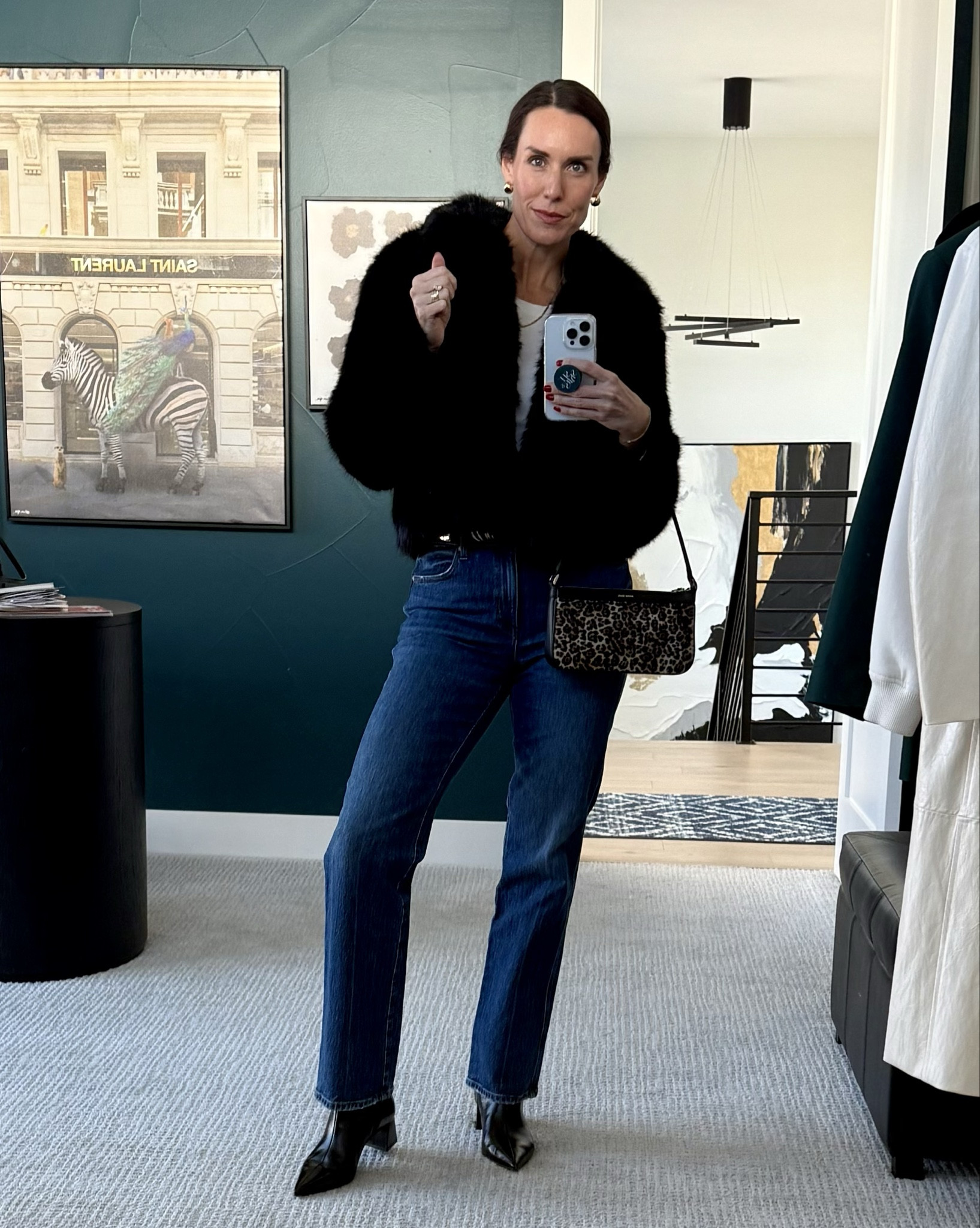 Don’t save the fun pieces for only a ‘special occasion’. Balance the fab faux fur coat with a classic everyday foundation of jeans and white long sleeve tee. Then polish off with boots and accessories! Belt, stacked bracelets, leopard print purse. 💃🏻

#LTKOver40 #LTKootd