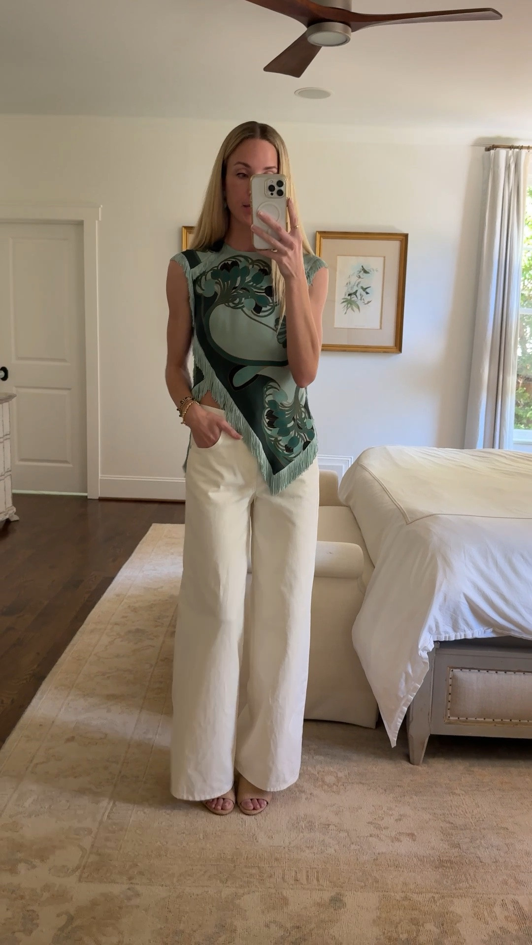 La Double J scarf top (similar linked), TWP white wide leaf jeans (great evening jean for summer and going out). Similar shoes linked

Summer top, summer blouse, white jeans, fringe top