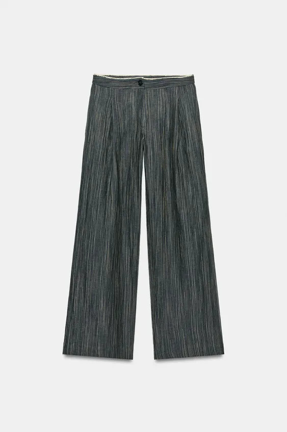 ZARA WOMAN COLLECTIONMid-waist trousers made from linen blend yarn. Featuring side pockets hidden... | Zara UK