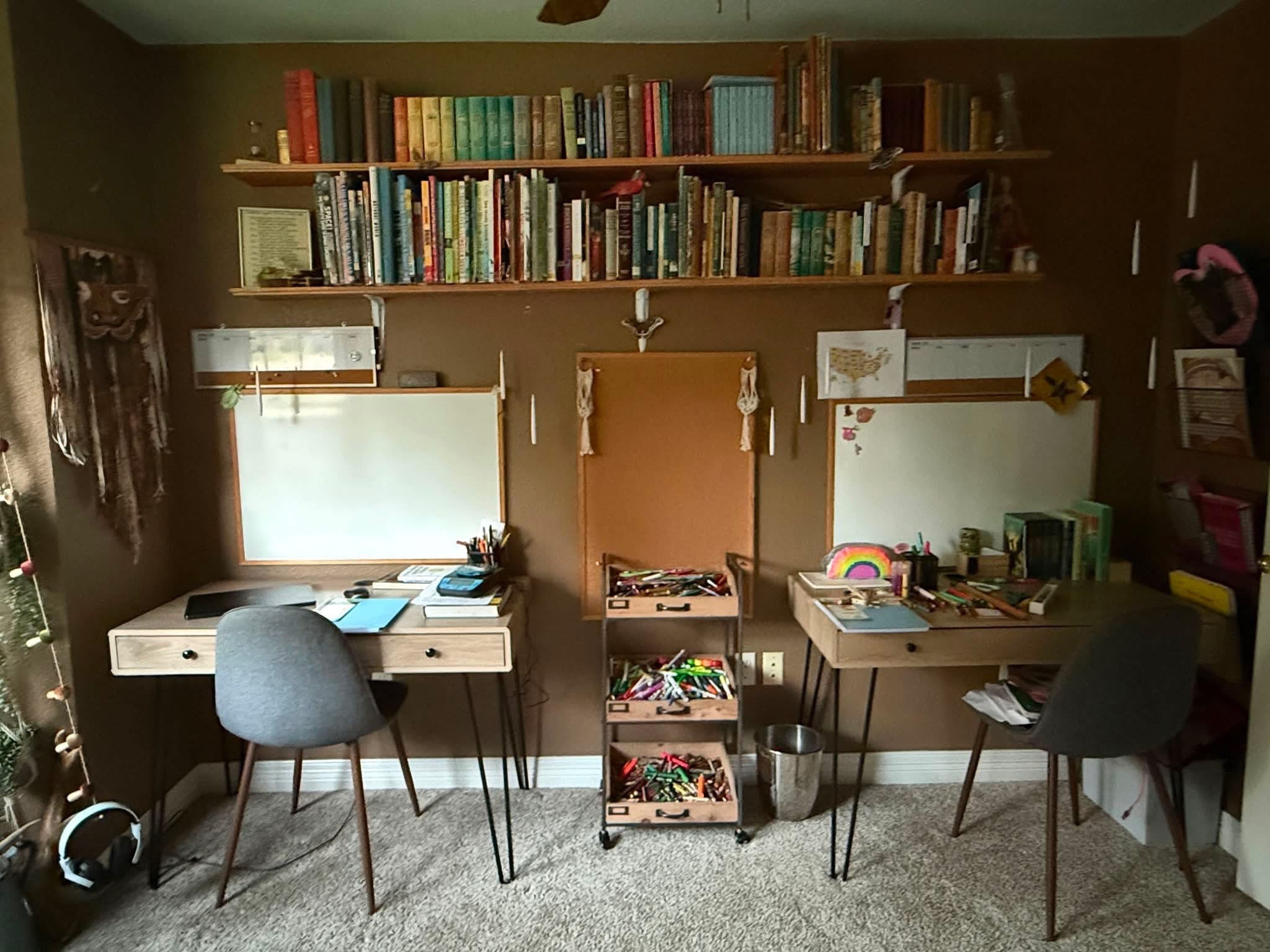 A snapshot of our school room set up. We’re 11 years into our homeschool journey and these desks have worked well from my kids from age 9 and up. I love adding little touches of whimsy to our school room. Over the last 11 years it’s slowly evolved into the perfect space for us!