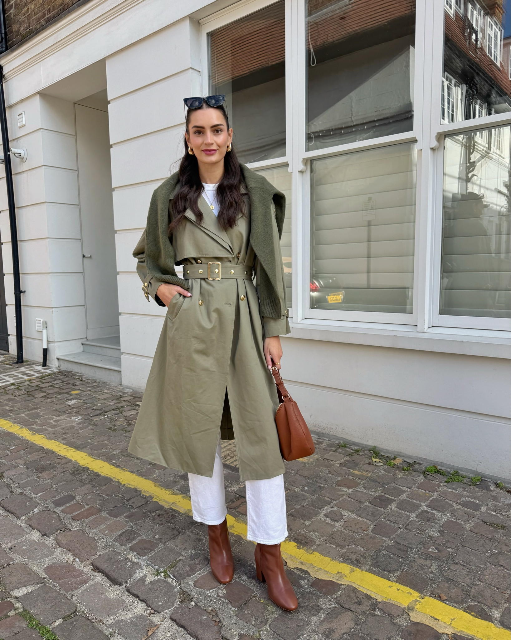 Khaki green trench coat, white T-shirt, khaki cardigan for layering, white straight leg jeans, brown boots and shoulder bag

#LTKautumn #LTKuk