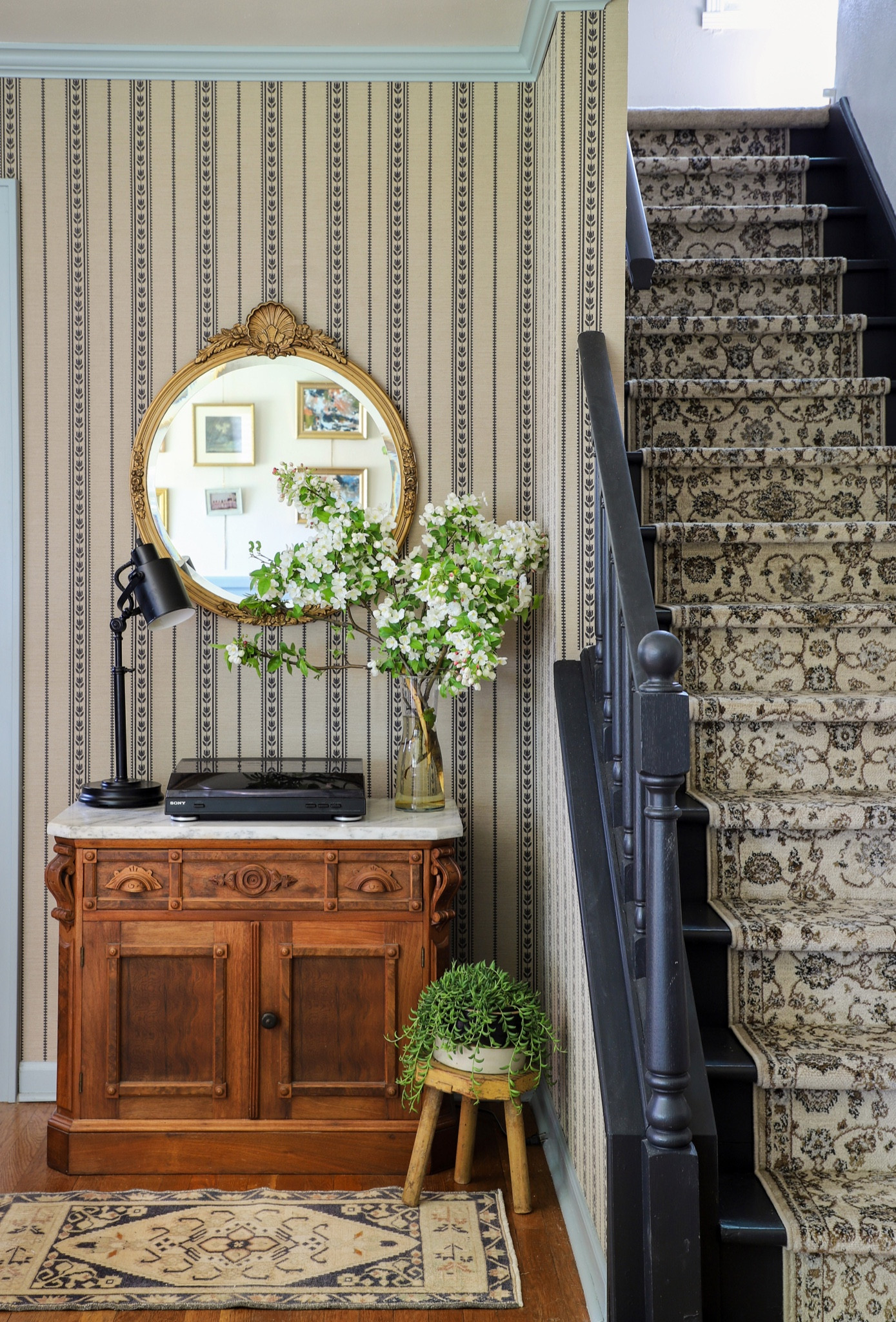 This corner of my nephews living room has so much character. With the touch of wallpaper and mix of vintage furniture, it’s the perfect for kicking back and listening to some records. 

As seen on Makeover by Monday, Season 2  


#LTKhome