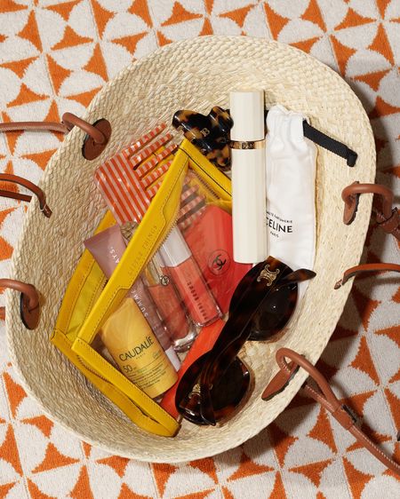 Summer essentials what’s in my bag 🧡

Loewe Small Anagram Basket
Caudalie Sunscreen Stick
Summer Fridays Lip Butter Balm
Armani Prisma Glass Honey Gleam
Bobbi Brown Lip Serum Bare Peach
Celine Sunglasses
Glossier Comb

Not linked:
Chanel Mirror (discontinued)
Celine Travel Perfume Atomizer
Anya Hindmarch Clear Pouch (sold out, linked similar)