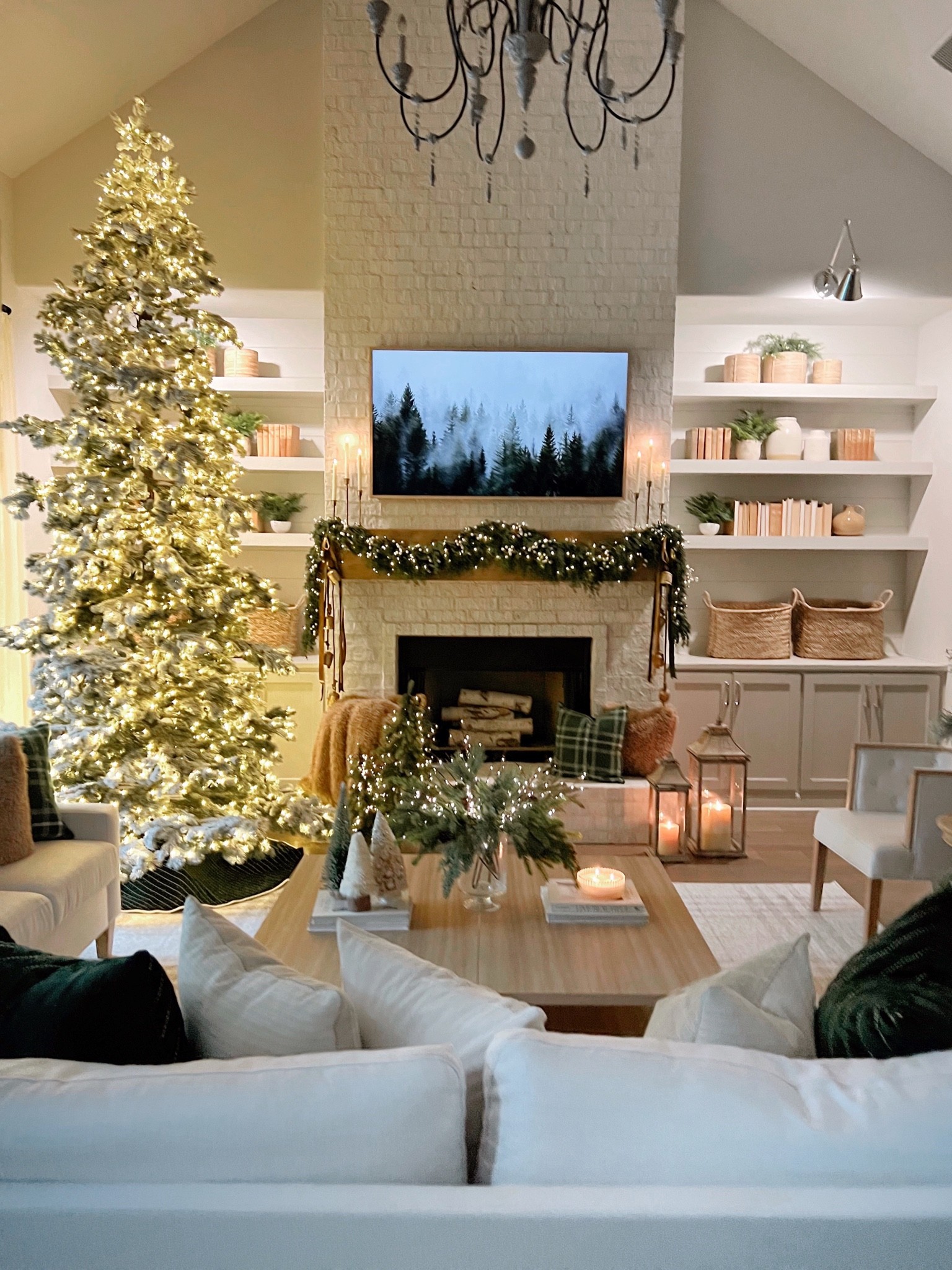 Christmas living room decor 
Flocked tree 

#LTKHoliday #LTKSeasonal #LTKhome