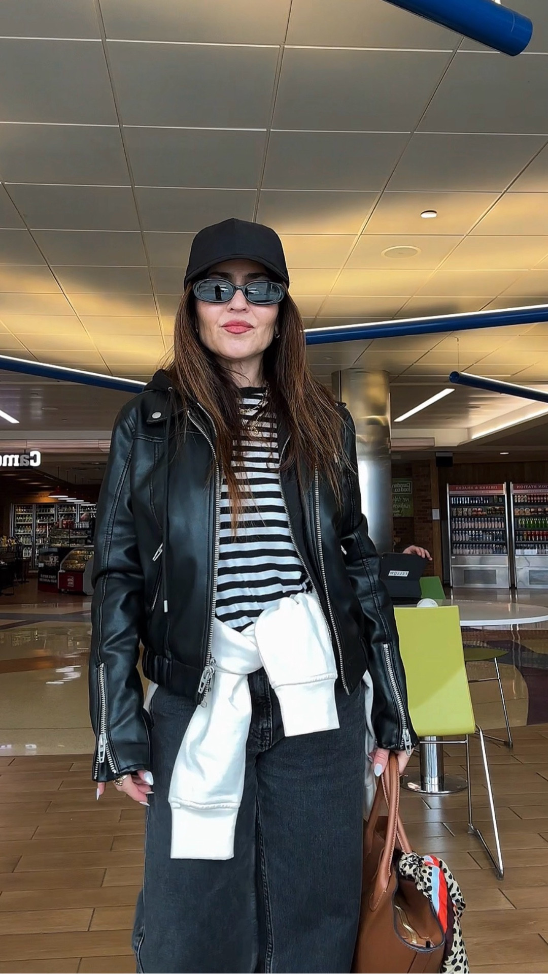 Airport style doesn’t have to mean oversized sweats and looking exhausted. 

This is my formula:
• Stripes (timeless)
• Leather jacket (instant structure)
• Soft layer tied at the waist for the flight
• Dark denim (polished but comfortable)
• A cap + slim sunglasses for that effortless edge

Comfortable. Elevated. Intentional.

And yes, the extra layer around the waist is not just styling. It’s strategic. Planes get cold. Always. Also saves space in my bag.

If you’re traveling soon, save this.

Travel smart. Dress sharp. Always.

date night outfits, sunday hoodie, statement coat, vacation outfits, winter denim, 

#LTKPetite #LTKSaleAlert #LTKootd