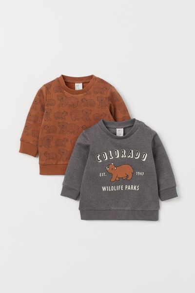 Sweatshirts in cotton fabric. Snap fasteners at back of one shoulder, long raglan sleeves, and ri... | H&M (US + CA)