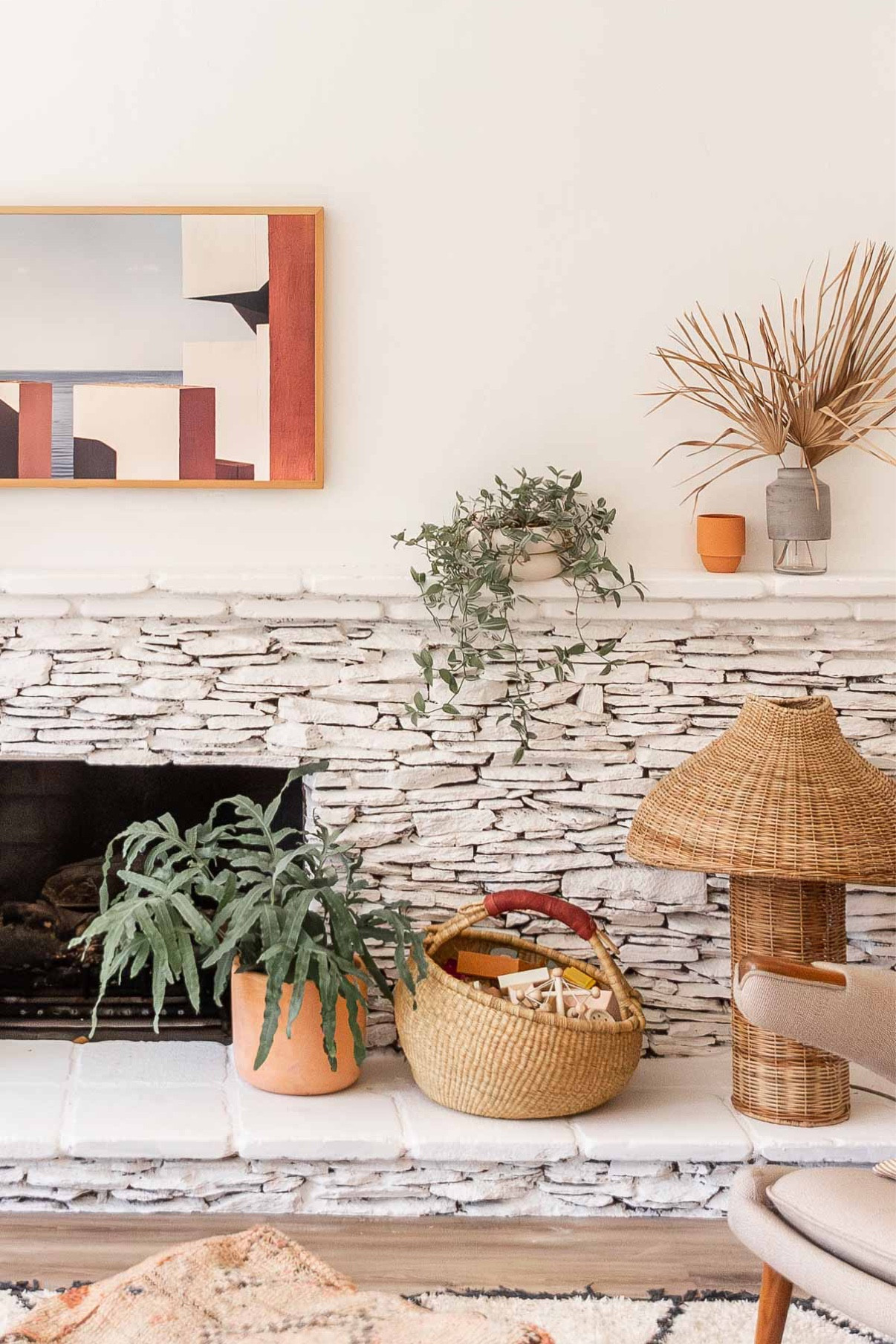 Earthy organic modern living room vibes with terracotta planters and natural woven baskets. Boho - home decor - fireplace styling - wicker -plants - Samsung frame tv

#LTKstyletip #LTKFind #LTKhome