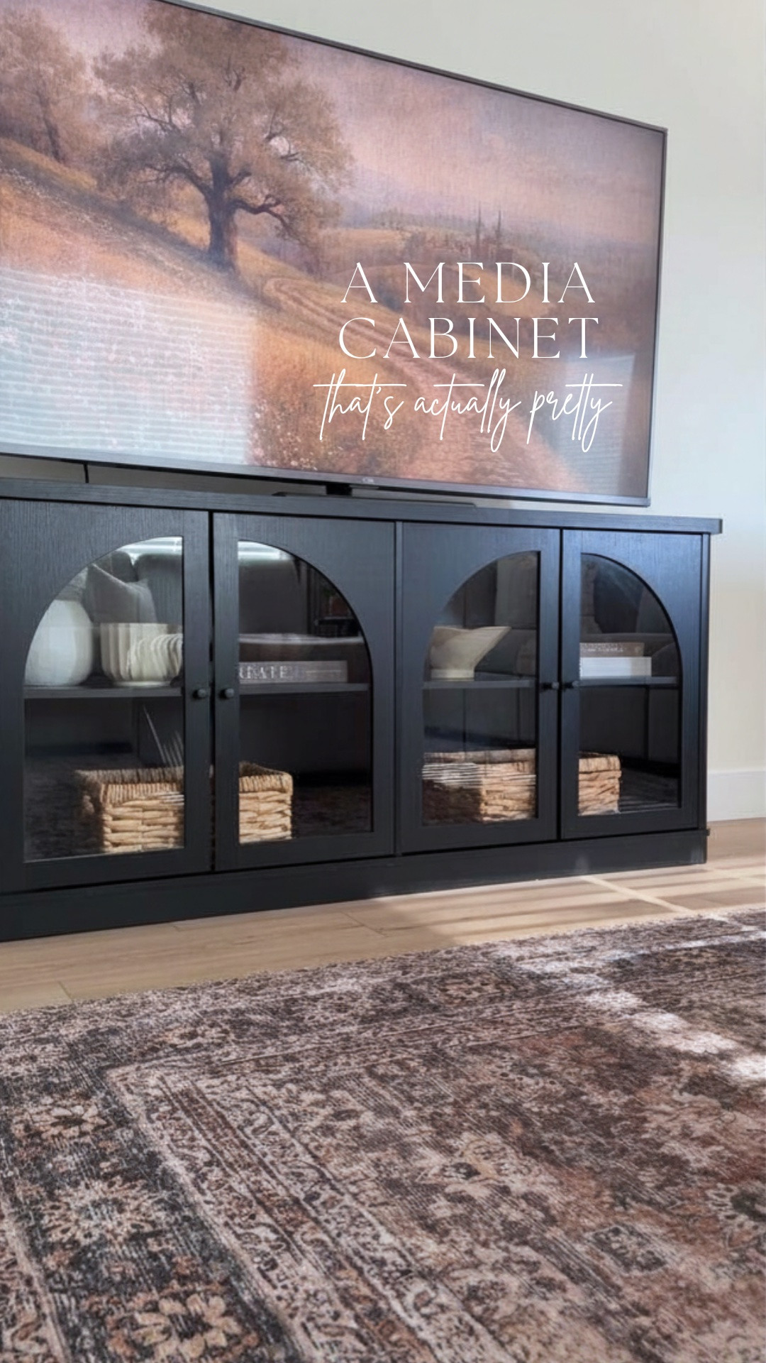 Such a good designer dupe for a fraction of the price 🖤 The arched glass doors give this media cabinet such an elevated look, while the spacious cabinets and baskets make it just as functional as it is pretty!

#LTKHome #LTKSaleAlert