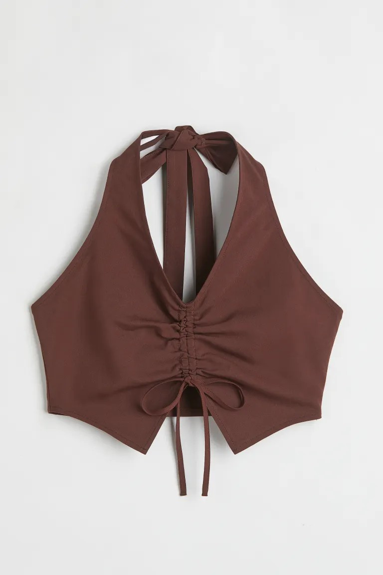 Conscious choice  Crop top in woven stretch fabric. V-neck at front, ties at back of neck, and dr... | H&M (US + CA)