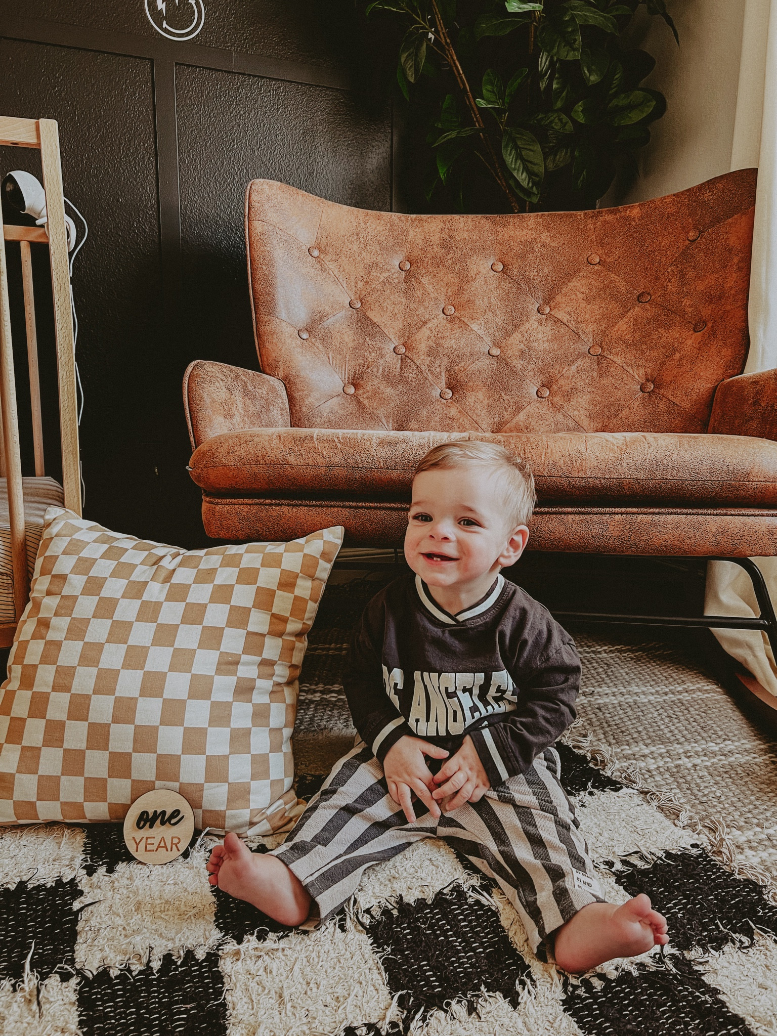 One year milestone picture! 🖤 Zara baby Los Angeles college league shirt - striped pants - 12 months old ✨

#LTKhome #LTKbaby #LTKkids