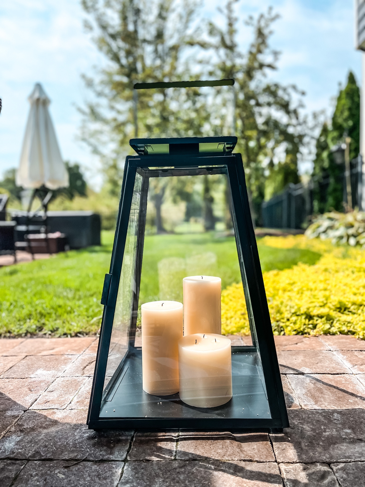 Huge Black outdoor lanterns  
*👉( pictured is the medium size )
- extra tall ivory pillar candles
- lanterns for porch 


#LTKhome #LTKSeasonal #LTKsalealert