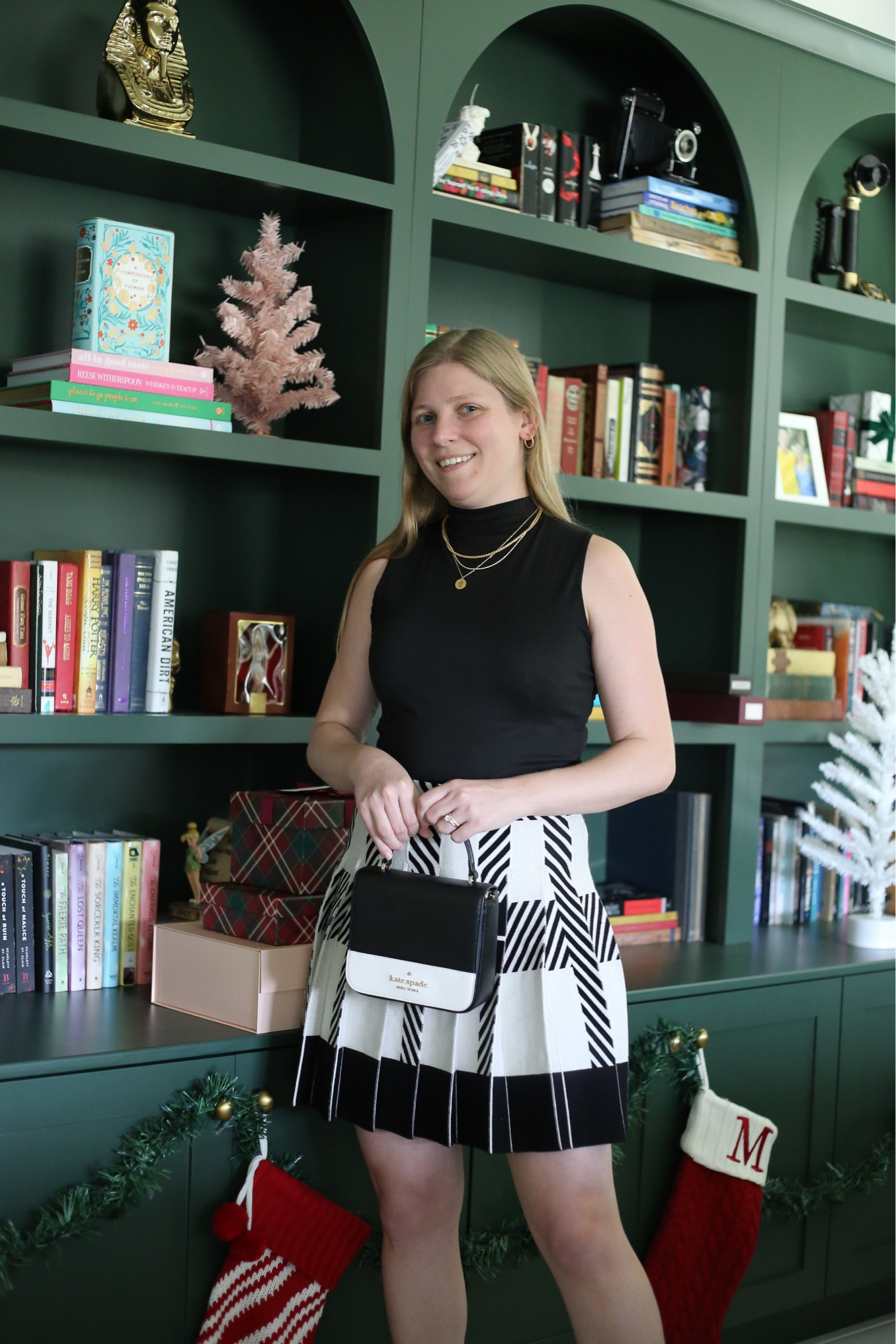 Chic winter look inspired by Blair Waldorf. Knit pleated skirt with black mock neck tank. 