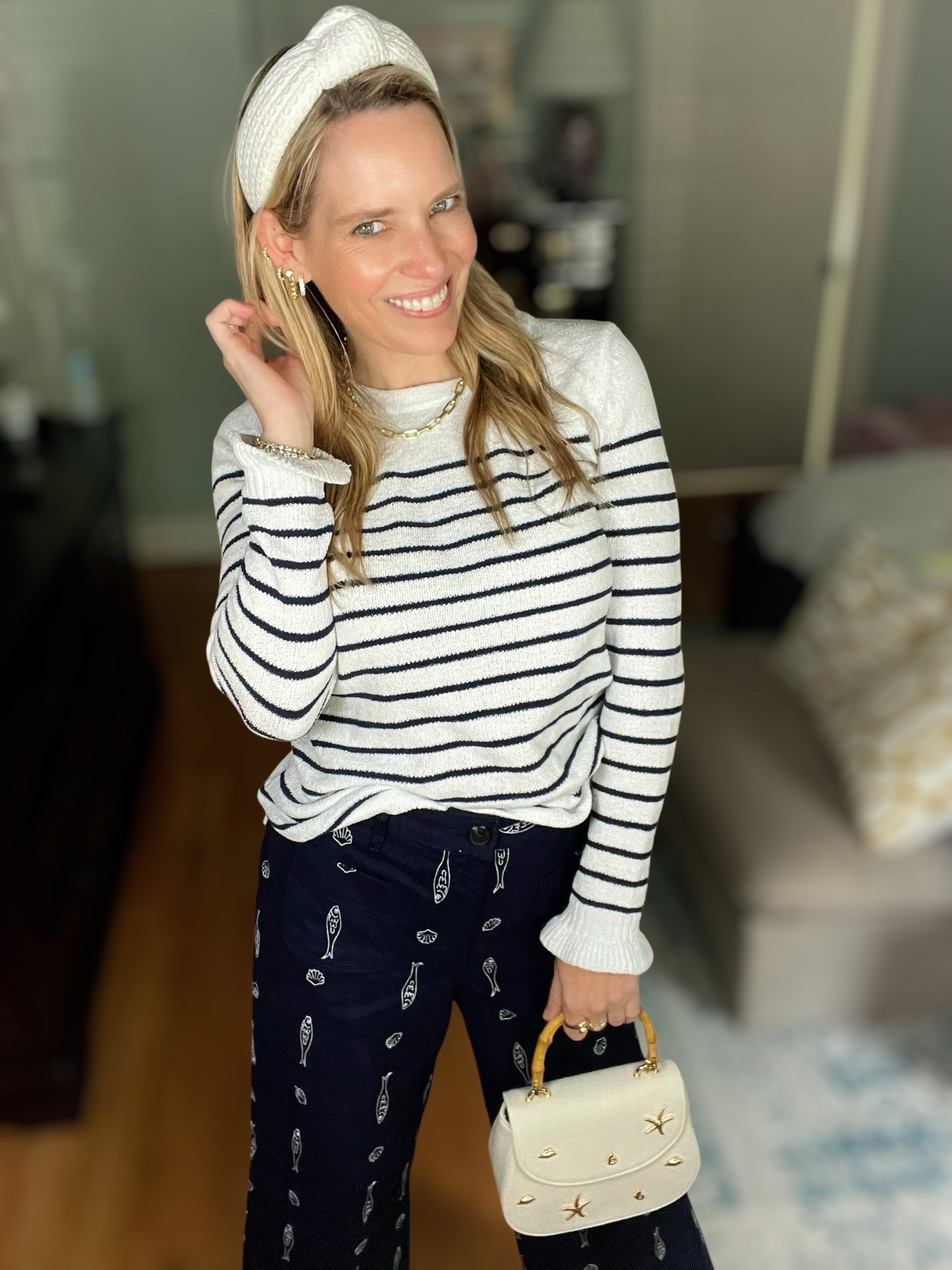 ⛵️ COASTAL CUTE & CLASSIC ⛵️
Use code PREPPYREBEL for 10% off my Melinda Maria jewelry! 💫

This outfit is giving major modern nautical vibes with a preppy twist! I’m pairing a lightweight striped sweater with these navy wide-leg pants covered in the cutest embroidered seashell and oar motifs. The combo is comfy but elevated, perfect for transitional weather or breezy beach town strolls! 🌊

🧵 Striped lightweight sweater – classic & versatile
🌊 Navy embroidered wide-leg pants – fun coastal prints
👜 White mini bag with gold starfish accents
👑 White textured headband + pearl Melinda Maria hoops (use PREPPYREBEL for 10% off!)
👠 Ivory flats – comfortable & timeless
📏 Pants fit TTS – wearing size XS

This look feels polished yet playful—ideal for a coastal weekend or casual dinner al fresco 🌞

#coastalstyle #preppyrebelstyle #nauticalfashion #melindamariajewelry #ltkunder100 #classicstyle #stripedtop #summerstyle #preppylook #seashellstyle 🌟

#LTKOver40 #LTKFindsUnder100 #LTKFindsUnder50

#LTKFindsUnder50 #LTKOver40 #LTKFindsUnder100