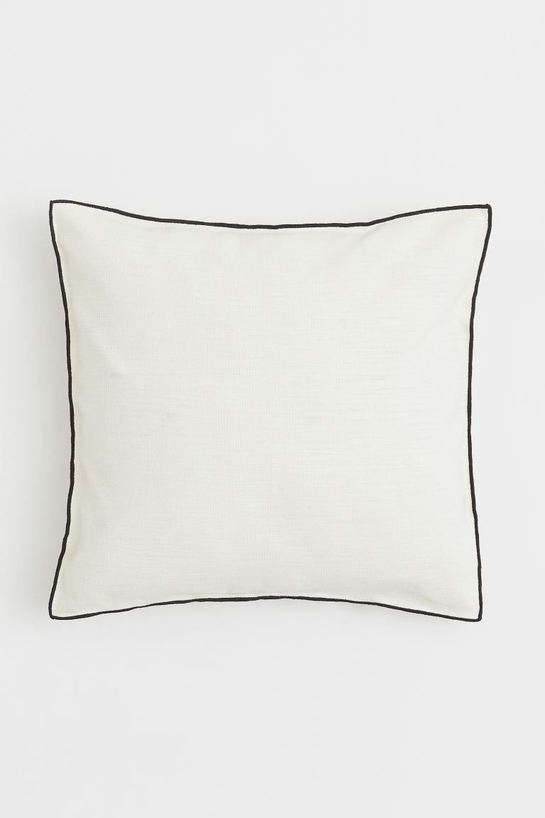 Cushion cover in a woven cotton and linen blend. Contrasting stitching at edges and a concealed z... | H&M (US + CA)