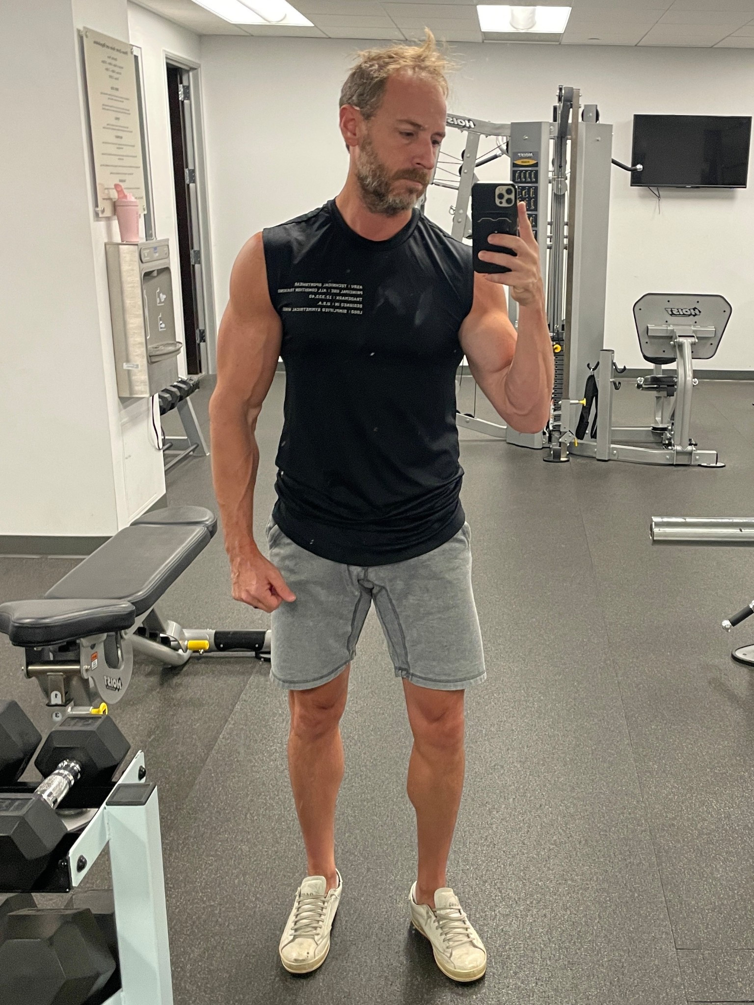 Sleeveless shirt and no socks.