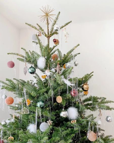 Festive Christmas tree with sparkly ornaments and shiny tinsel! 

#Christmas #Christmastree #Christmasdecor 

#LTKSeasonal #LTKhome #LTKHoliday