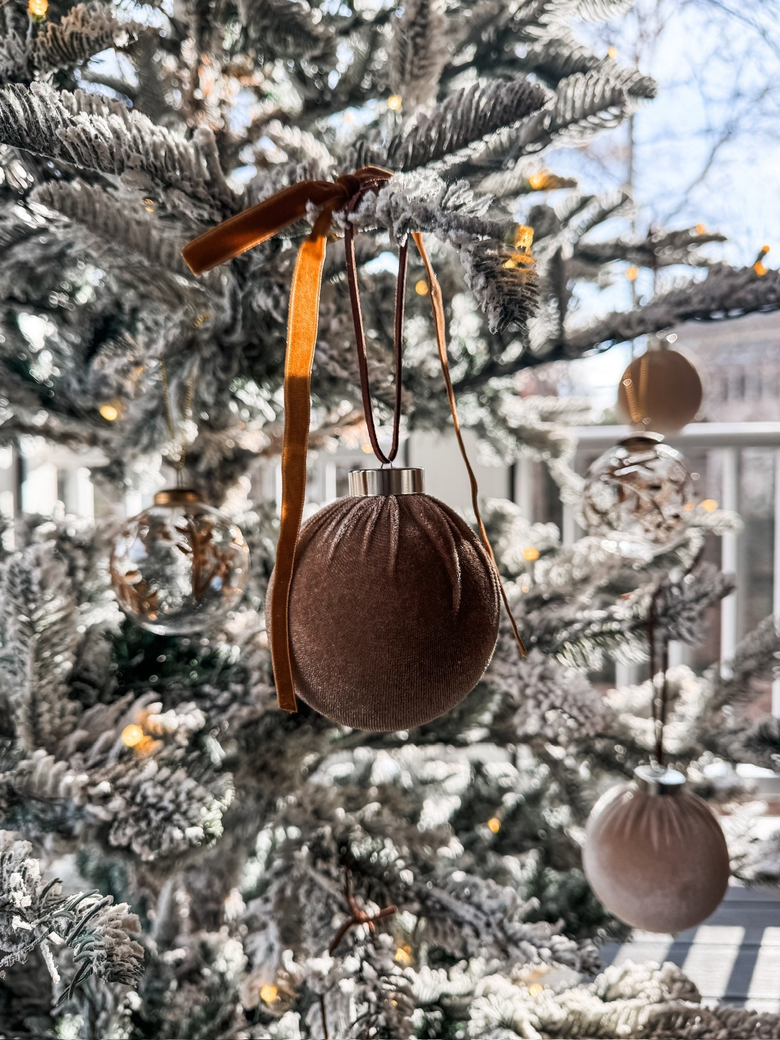 A closer look at this year’s ornament lineup: velvet spheres, frosted matte ornaments, clear glass bulbs, and amber velvet ribbon tucked into the flocked branches.
The mix of texture and tone brings such a soft, moody elegance to the tree ✨
#eanesinteriors #holidayhome #christmastreeideas #flockedtree #ornamentdecor #holidaysathome


#LTKSeasonal #LTKHoliday #LTKHome