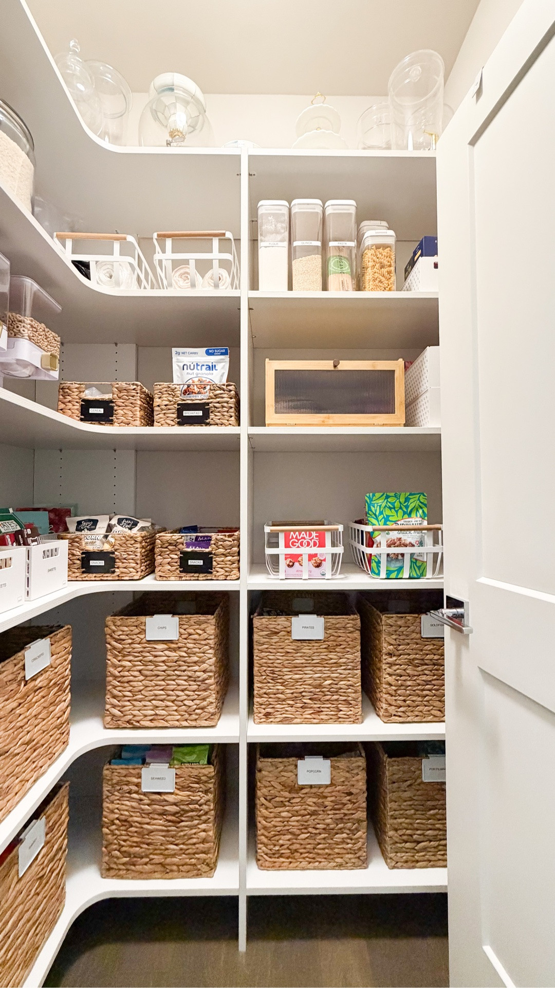 PANTRY ORGANIZATION! 🛒✨

This pantry was STRESSING me out! I finally took everything out, tossed so many expired items, and grouped everything by category. The best part is that I barely bought any new containers!

Here’s what I did differently:
• Low-profile baskets for small snacks: I can actually see everything now instead of digging through big baskets of random snacks.
• Less decanting: I had way too many jars, and transferring everything was extra work for items we barely used.
• Labeled everything: I never really labeled before, which made it way too easy to forget what we had.
• Ditched the rolling can rack: Cans in the back were always getting forgotten so now I use a behind-the-door organizer where I can see everything at once.

I LOVE how this pantry organization turned out, and I’m actually confident we can keep it this way! 🙌🏼 #pantryorganization #kitchenorganizationideas

Baskets, fruit basket, Bamboo bread box, foil and plastic wrap organizer, rice storage container, canister jar set, storage basket, food dispenser, over the door pantry organizer

#LTKsummer #LTKhome
