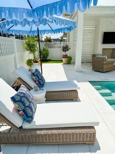Our outdoor cabana and pool deck featuring woven chaise lounge chairs, light blue double scalloped umbrellas, reversible block print pillows, outdoor swivel chairs, and planters filled with oleander, petunias, and sweet potato vines!
.
#ltkhome #ltkfindsunder50 #ltkfindsunder100 #ltkseasonal #ltkstyletip #ltksalealert

#LTKHome #LTKSeasonal #LTKSaleAlert