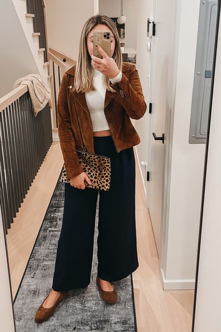 Suede Moto Jacket - wearing a medium.
White Turtleneck - old, but linked similar styles. Wear a bodysuit instead of a crop for a work outfit!
Navy Blue Wide Leg Trousers - a great Amazon find, wearing a Medium. Brown Flats - soooo comfy and so inexpensive.
Leopard Clutch - a classic!

#LTKworkwear #LTKSeasonal #LTKstyletip