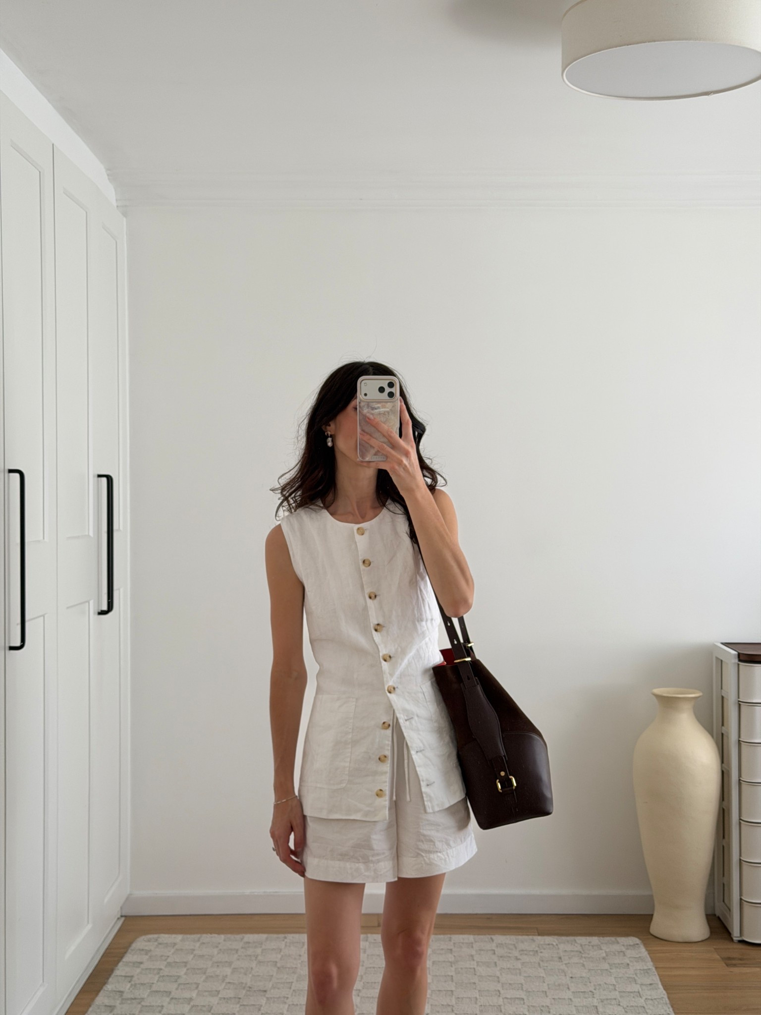 Wearing linen vest in size XS and shorts in size S