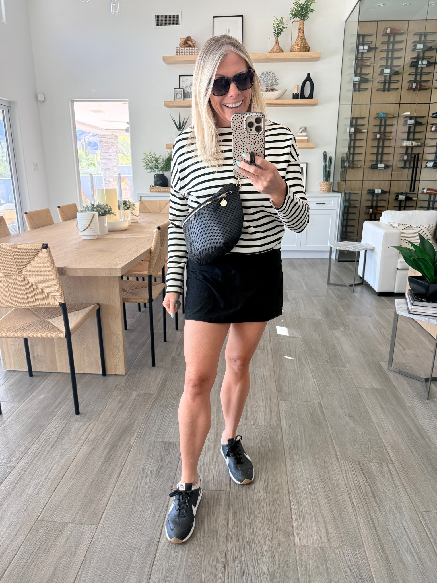 Striped shirt with a black skirt and Nike sneakers. Size small in everything sneakers tts 

#LTKootd #LTKOver40 #LTKmomlife