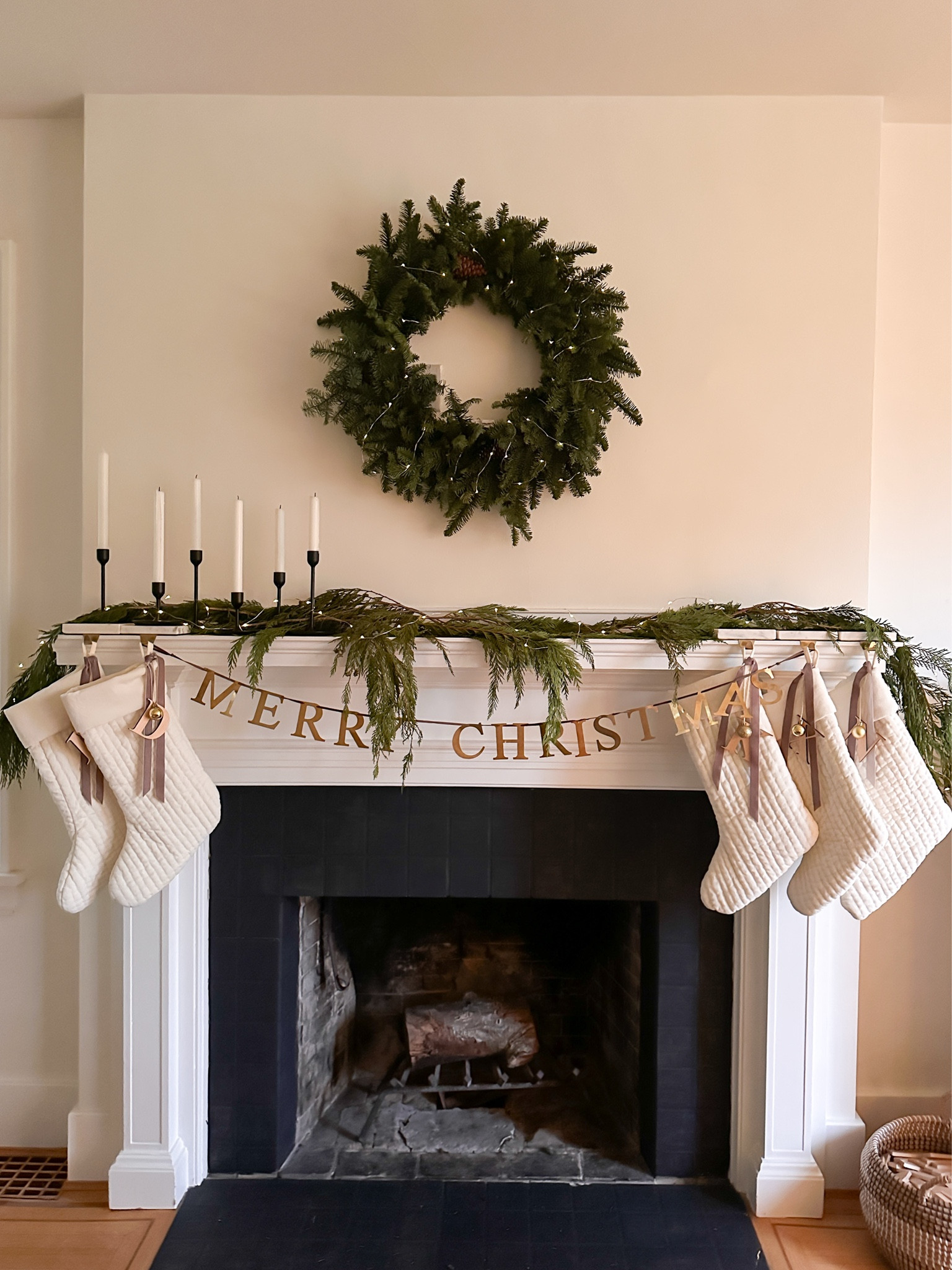Holiday mantel 2024! First time I’ve ever done a wreath and I love it. Greenery is real, candlesticks are from Ikea. The stockings come in cream as ours are, as well as the red shown in the link.

#LTKHome #LTKHoliday #LTKFamily