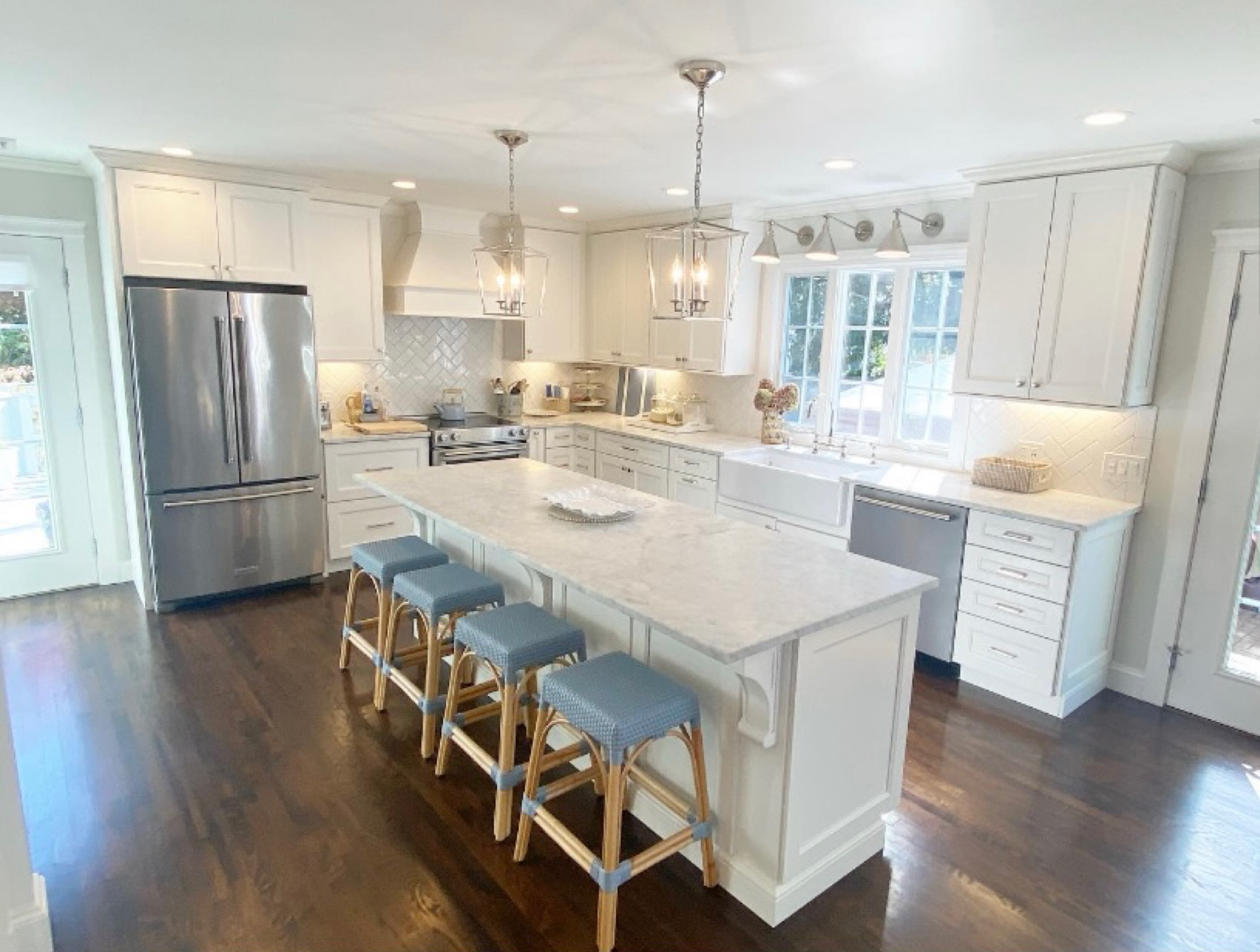 Coastal blue and white grandmillenial kitchen .