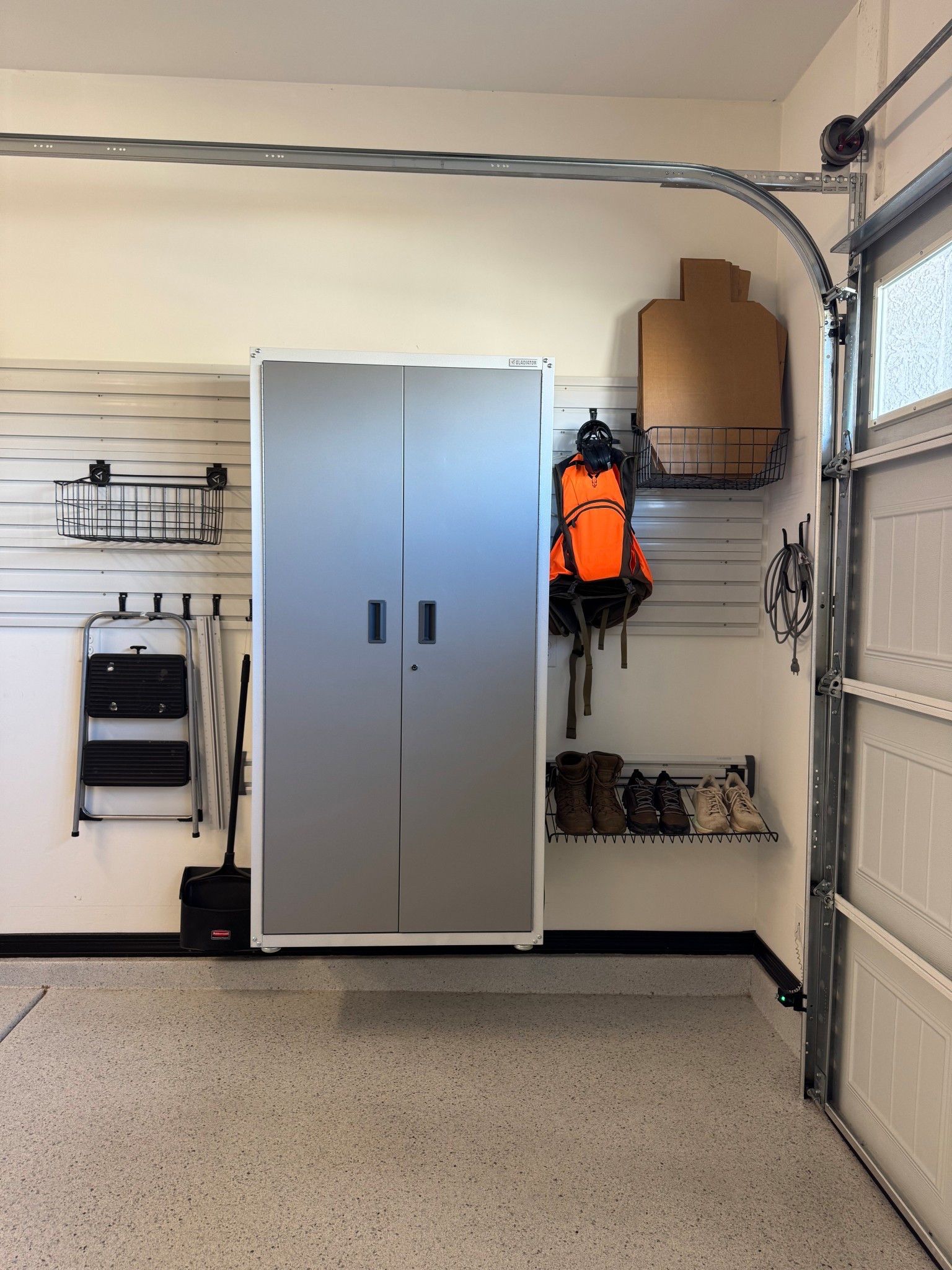 Loving our gladiator garage works gear track system and cabinet we installed over the holiday break. It has provided so much storage and keeping things off the floor. #gladitorgarage #garagecabinets #lowes 

#LTKHome