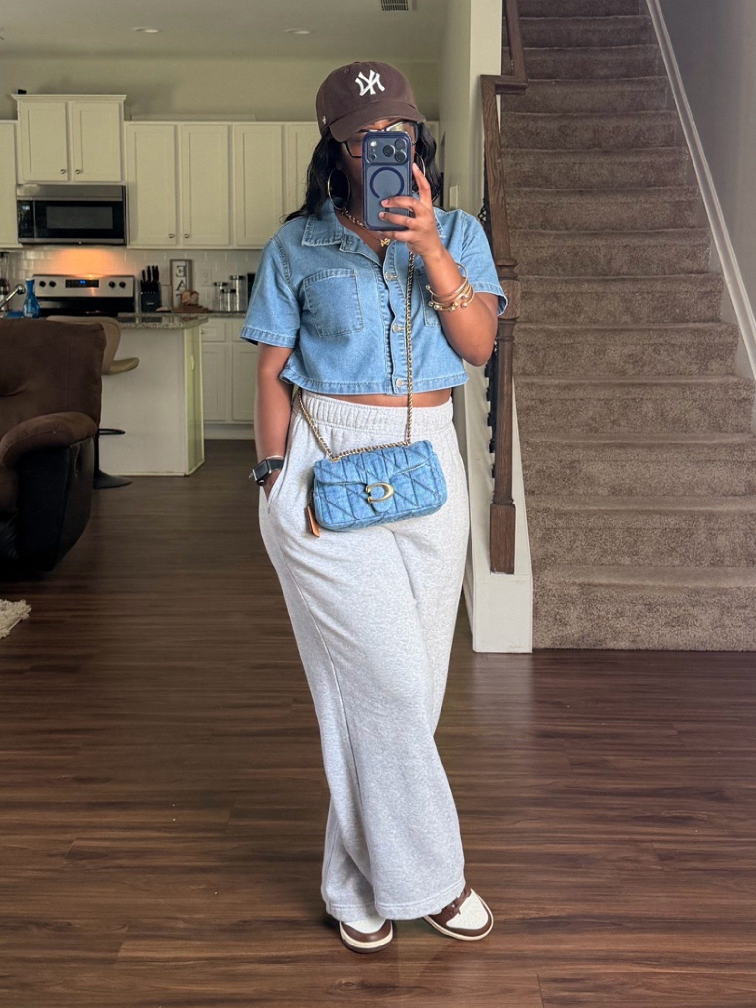 I’m on my way to Walmart and here’s what I’m wearing to run errands in. I’m wearing a denim shirt, gray sweatpants, brown hat, brown and white Nike dunk low sneakers. I styled this casual outfit with gold accessories and a denim Coach crossbody bag

#LTKootd #LTKPetite #LTKOver40