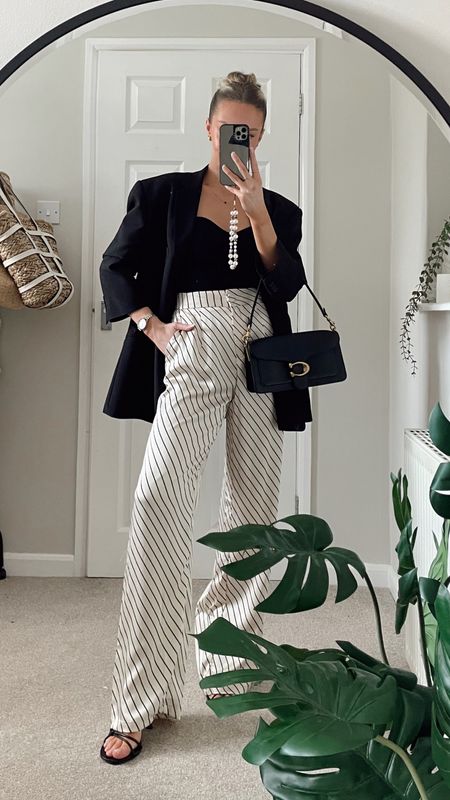 Oversized black blazer, strapless ribbed black top from Amazon, satin high waisted wide leg striped trousers from 4th and reckless, coach tabby 26 bag, black heel sandals

#LTKSeasonal #LTKstyletip #LTKeurope