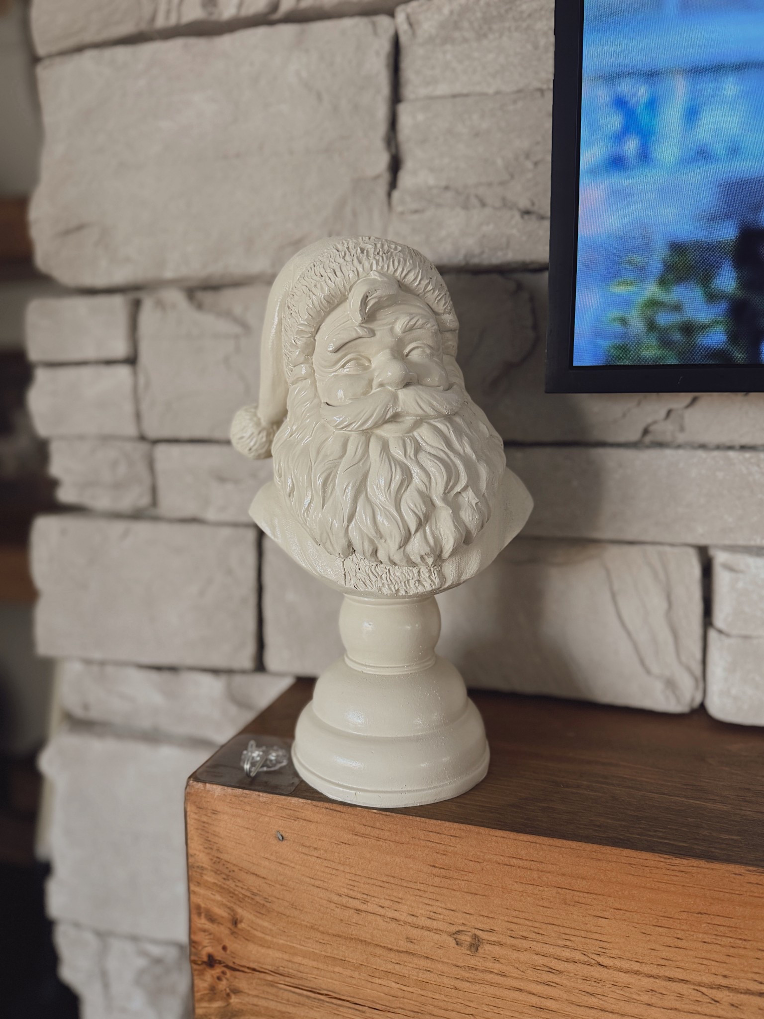 This neutral Santa bust is the perfect mix of festive + classy 🤍 I love how it blends with my stone fireplace and wood tones without feeling over-the-top Christmas. Such a timeless piece you can bring out year after year!  🎄✨

#neutralchristmas #christmasdecor #holidayhomedecor #ltkholiday #ltkhome #christmasstyle #holidaymantel #ltkdecor
