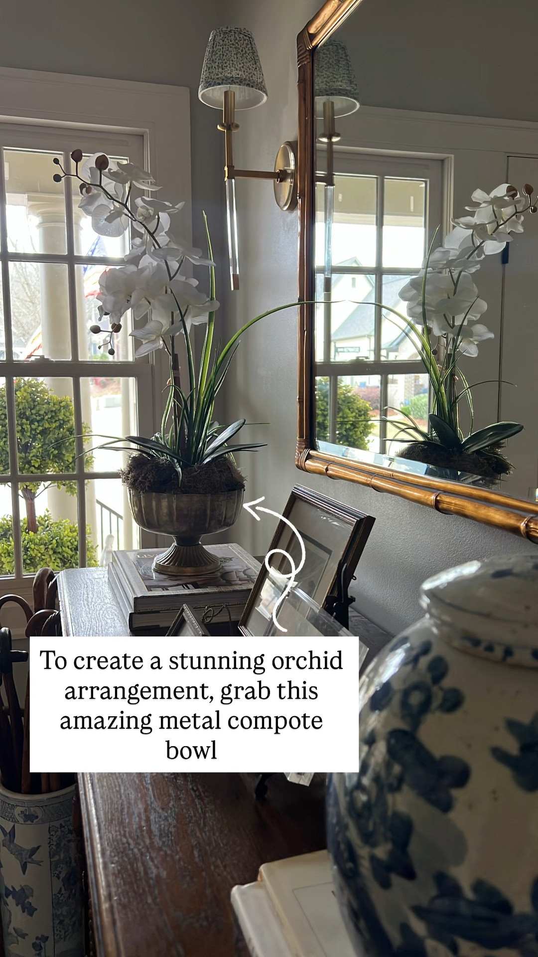 Orchid arrangement metal compote bowl acrylic sconce boxwood topiary entryway decor 

#LTKHome