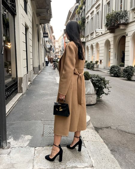 Kat Jamieson wears a camel coat, black heels and black purse in Milan. Classic style, chic, winter outfit, spring transition. 

#LTKshoecrush #LTKitbag #LTKSeasonal