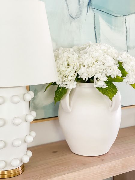 Seriously in love with these real-touch faux hydrangeas! This is after  I ordered another set for this large white ceramic vase (two sets total). They’re perfect for spring and summer decor (and come in several colors)! Also linking our long light wood console table, blue abstract art and circle dot lamp! 

. #ltkfindsunder50 #ltkfindsunder100 Amazon decor, favorite vase, designer lamp

#ltkhome #ltkseasonal #ltksalealert #ltkstyletip #ltkover40

#LTKfindsunder50 #LTKSeasonal #LTKhome