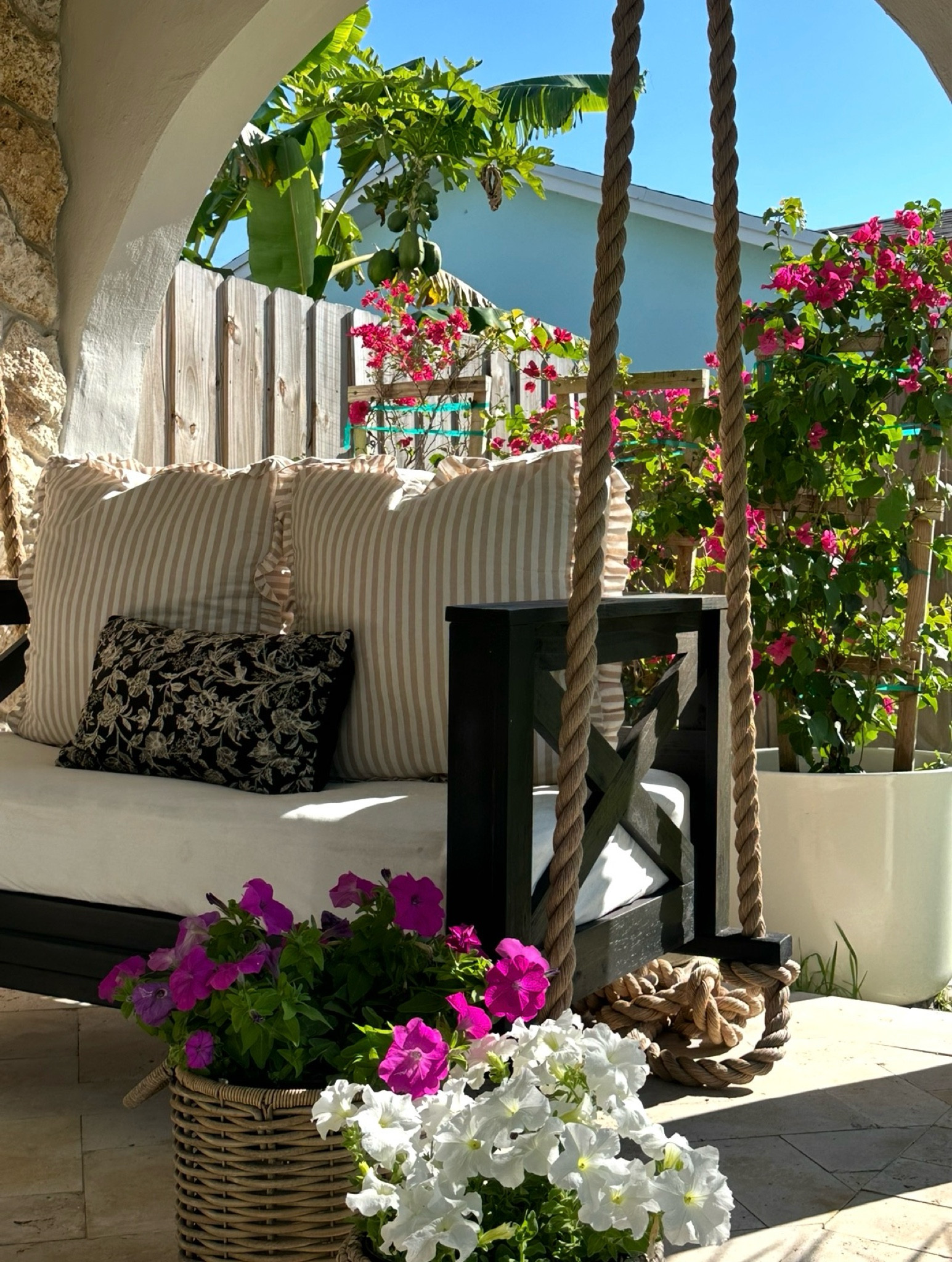 Front porch upgrades that instantly elevate your outdoor space. 🤍

I found similar porch swing options to the one my husband built, and several are currently on sale. I also linked the woven planter baskets I used with petunias in the front and bougainvillea in the background for a colorful summer porch.

One of my favorite details is the extra-thick rope on the swing. I ordered 1.5-inch rope and used about 50 feet total to give it that custom, high-end look. 

Upgrade your porch with these finds 
Porch swing 
Daybed 
Swing bed
Twin size porch swing 
Crib size porch swing 
Front porch decor
Front door
Summer
Cottage 
Beach house 
Resort 
Cozy home
Poolside 
Amazon 
Wayfair 


#LTKSaleAlert #LTKHome #LTKSeasonal
