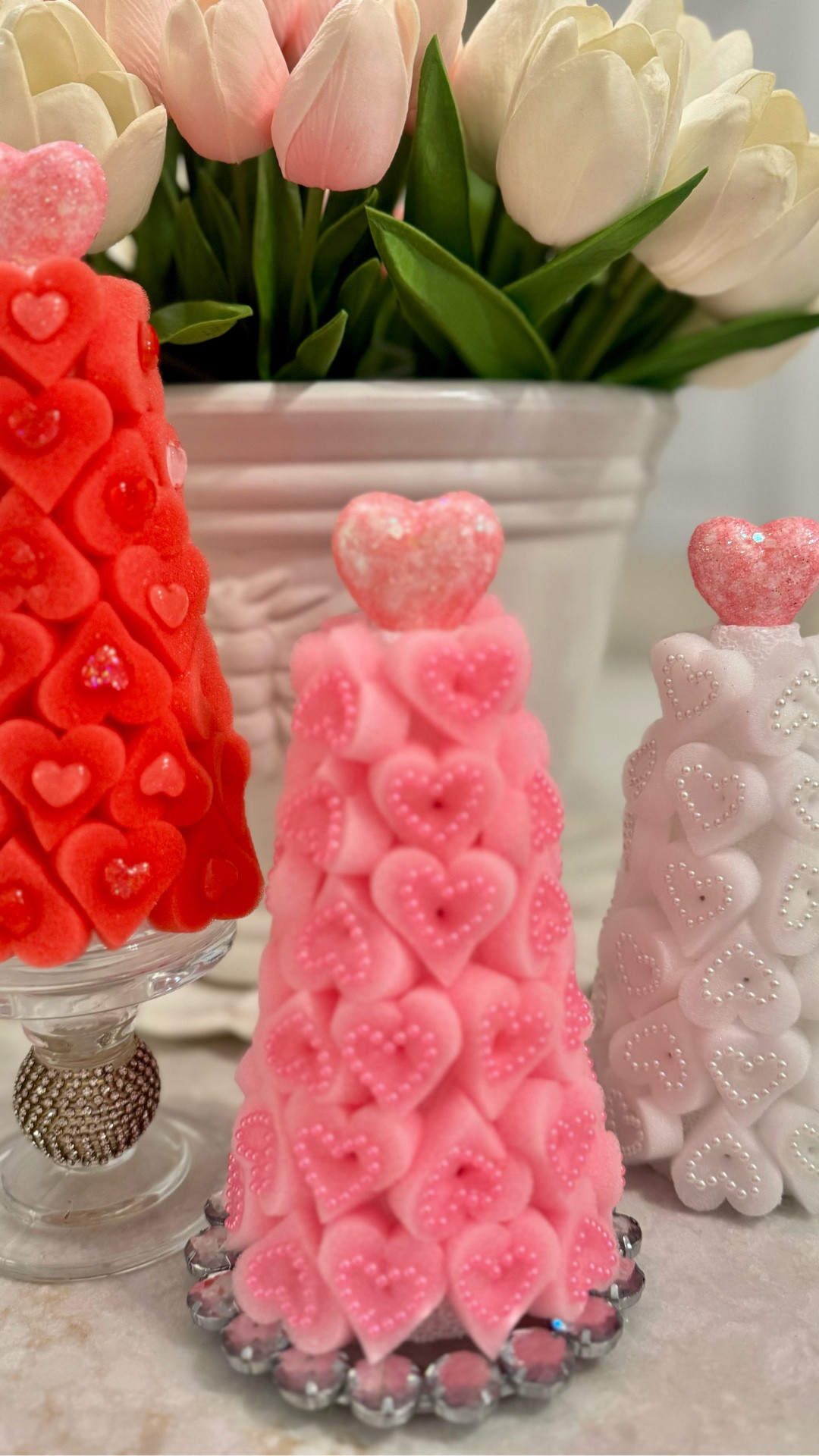 DIY Valentine heart topiary trees that add the sweetest pop of love to any space. Designed with layered heart details in soft pinks, blush, red, and white, these decorative topiaries are perfect for Valentine’s Day styling, tiered trays, shelves, entry tables, or festive vignettes. A charming handmade accent that feels playful, romantic, and totally gift-worthy — no flames, just heart-filled décor. 💗🌸
.
.
.
.
#ValentinesDecor #ValentinesDayDecor #HeartDecor #TopiaryDecor #DIYDecor #SeasonalDecor #PrettyDetails #RomanticHome #PinkDecor #ShelfStyling #TieredTrayDecor #HandmadeDecor #ValentineVibes #LTKHome #JustJennsDesign